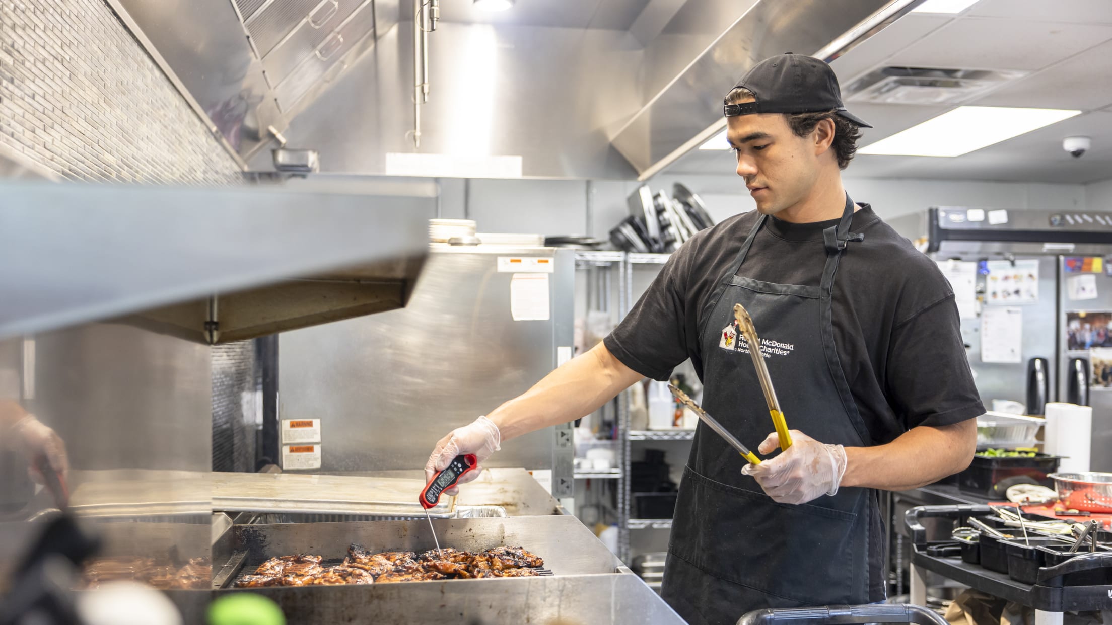 Joey Cantillo volunteers in the kitchen at the Ronald McDonald House.