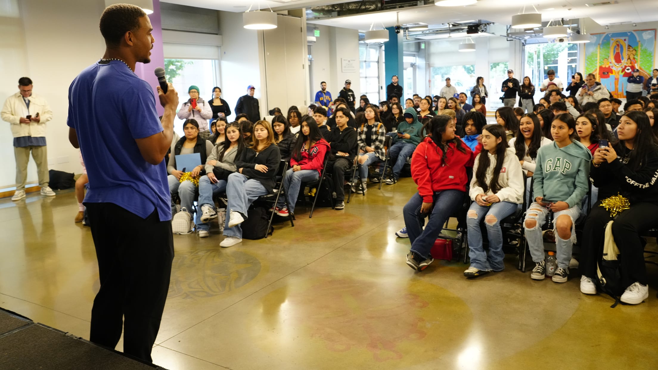 Julio Rodriguez speaks to students at El Centro de la Raza school.