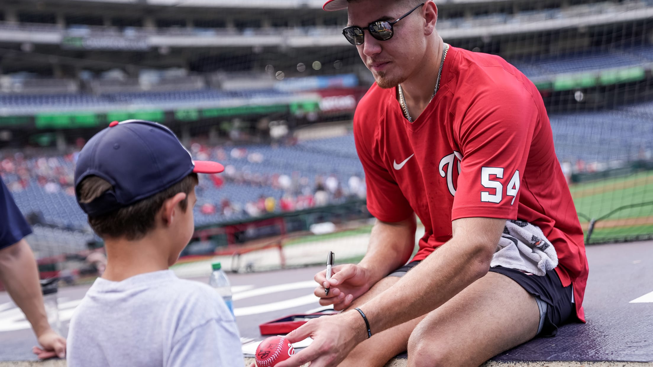 Nationals player signing autographs