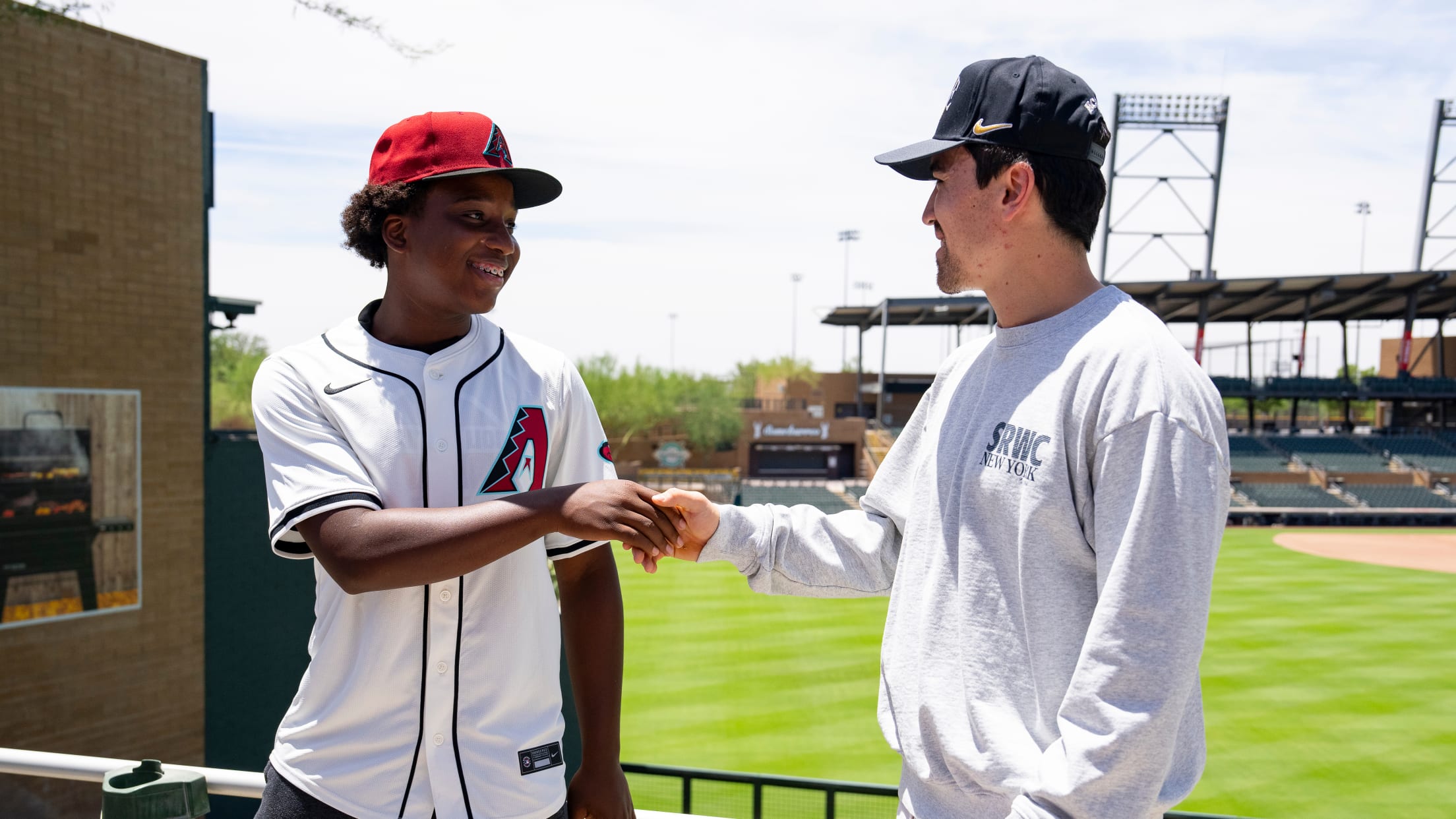 Corbin Carroll meets an Nike RBI player at Salt River Fields at Talking Stick.