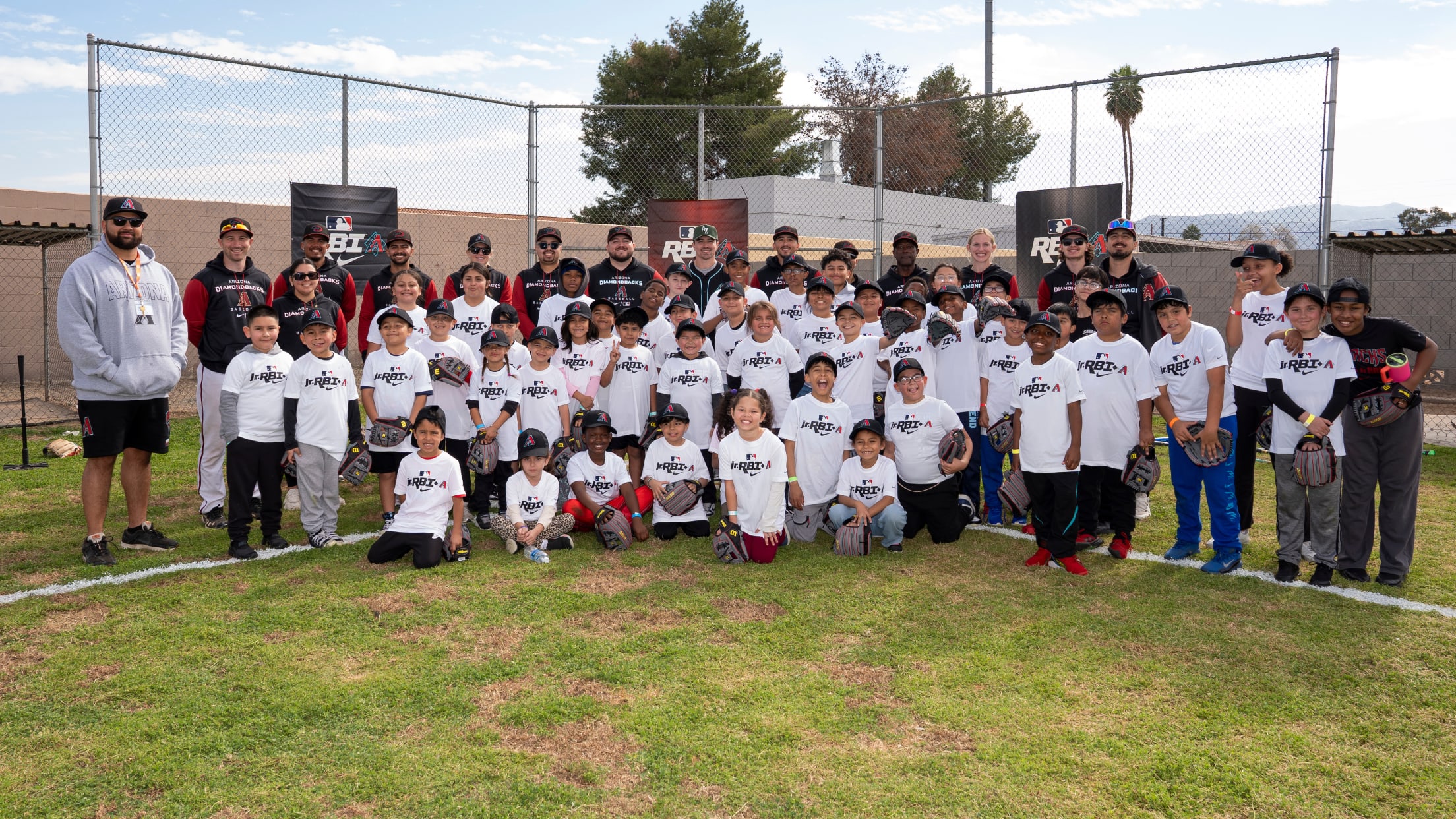 Corbin Carroll takes a picture with players from Nike Jr. RBI.