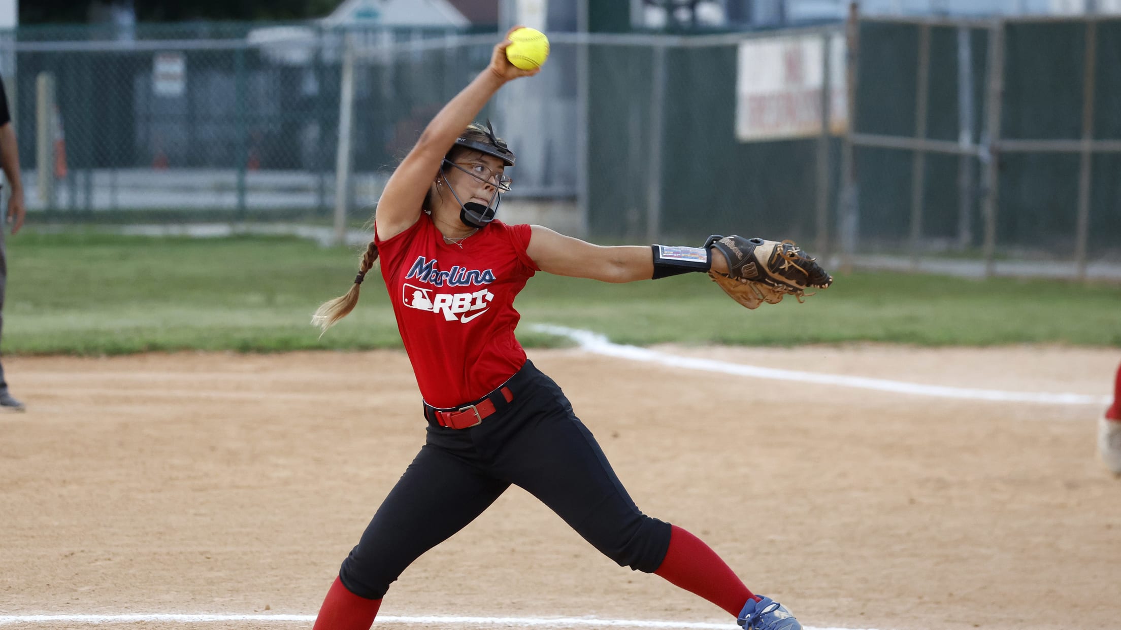 A pitcher winds up to throw at the Marlins Nike RBI Softball Classic.