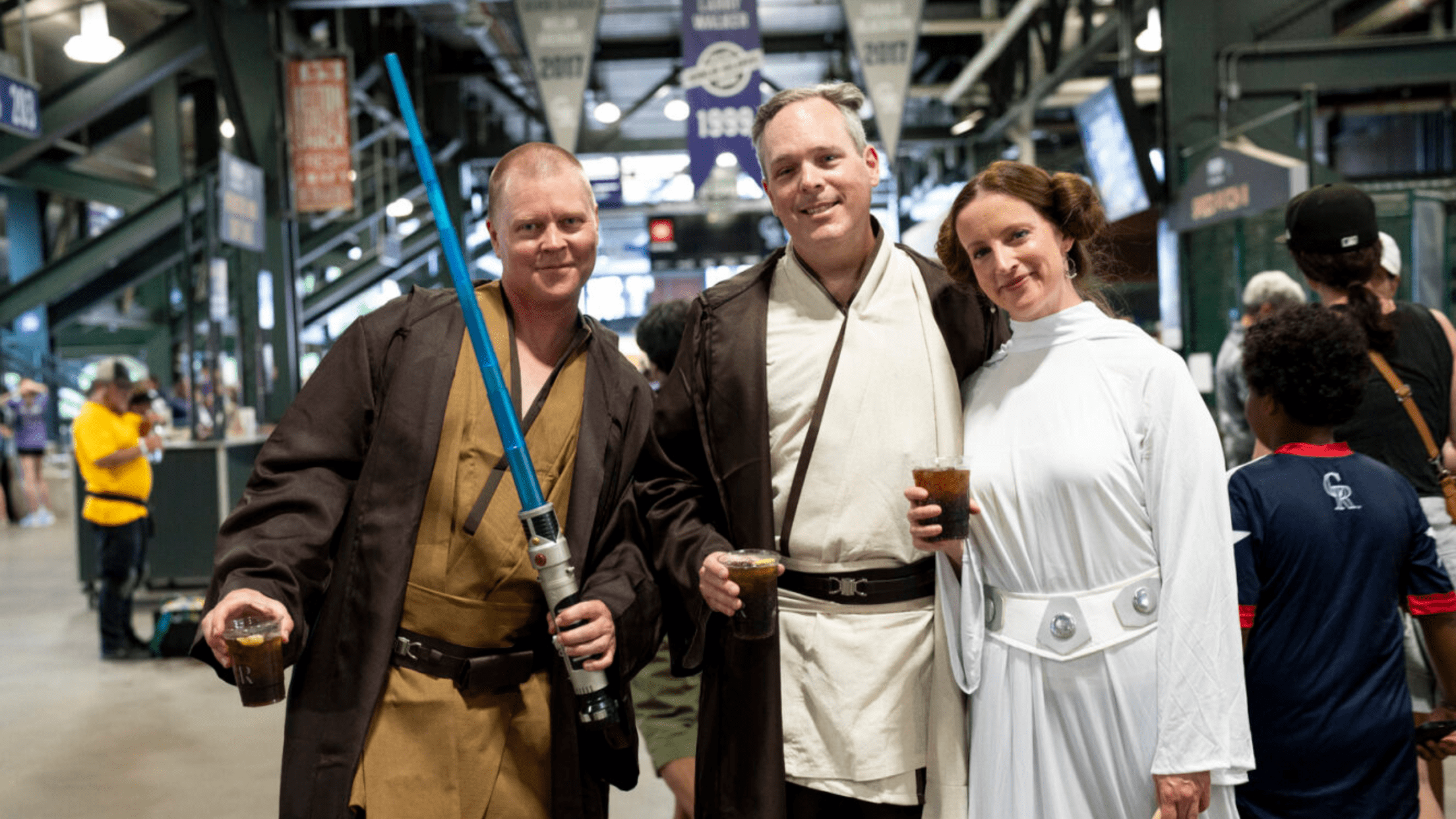 Fans in Star Wars costumes on concourse at Coors Field