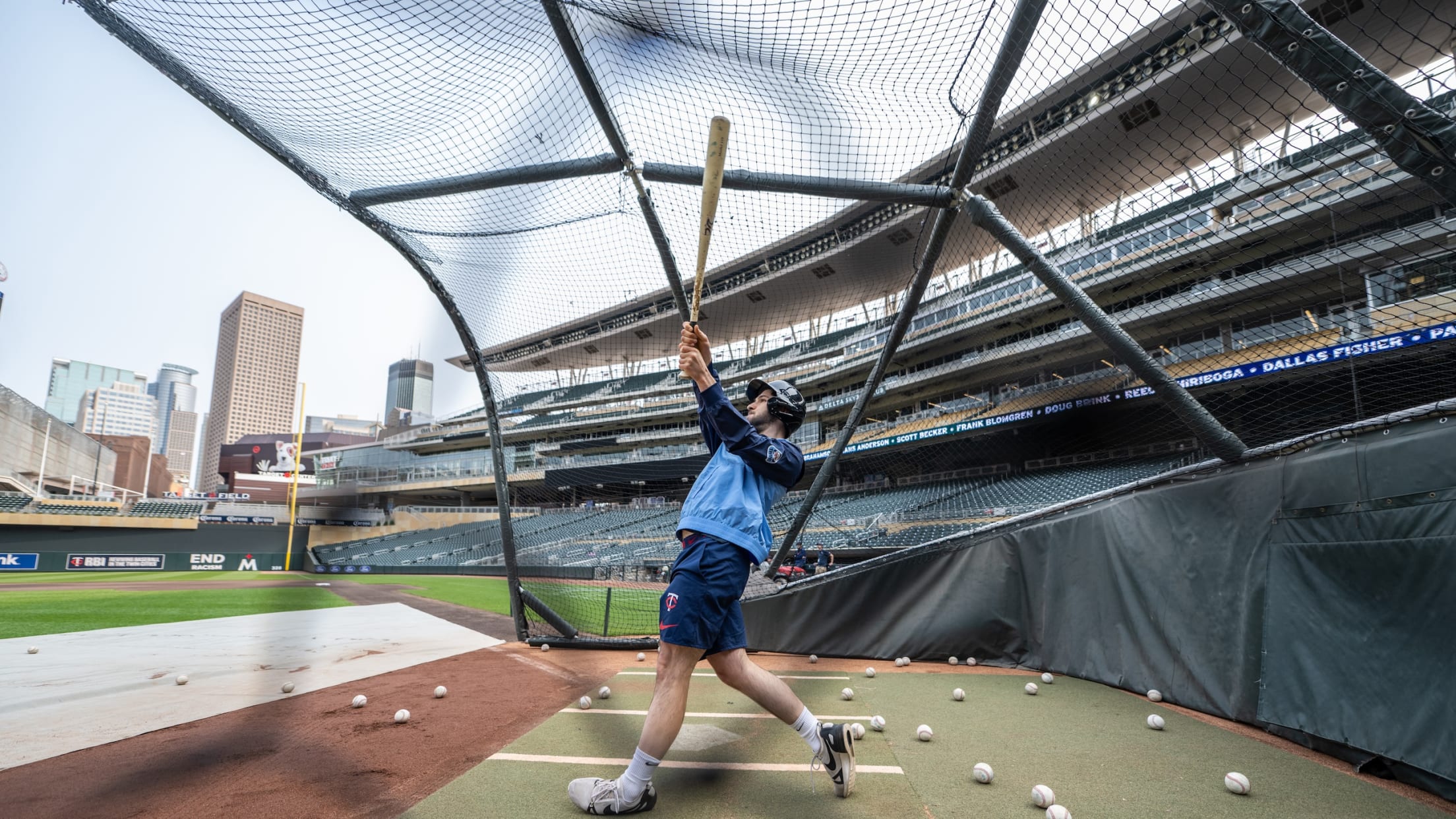 Fan taking batting practice at Target Field