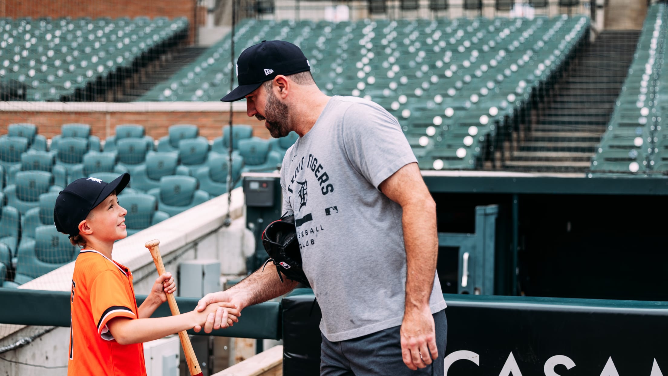Justin Verlander shakes hands with a young Detroit Tigers fan.