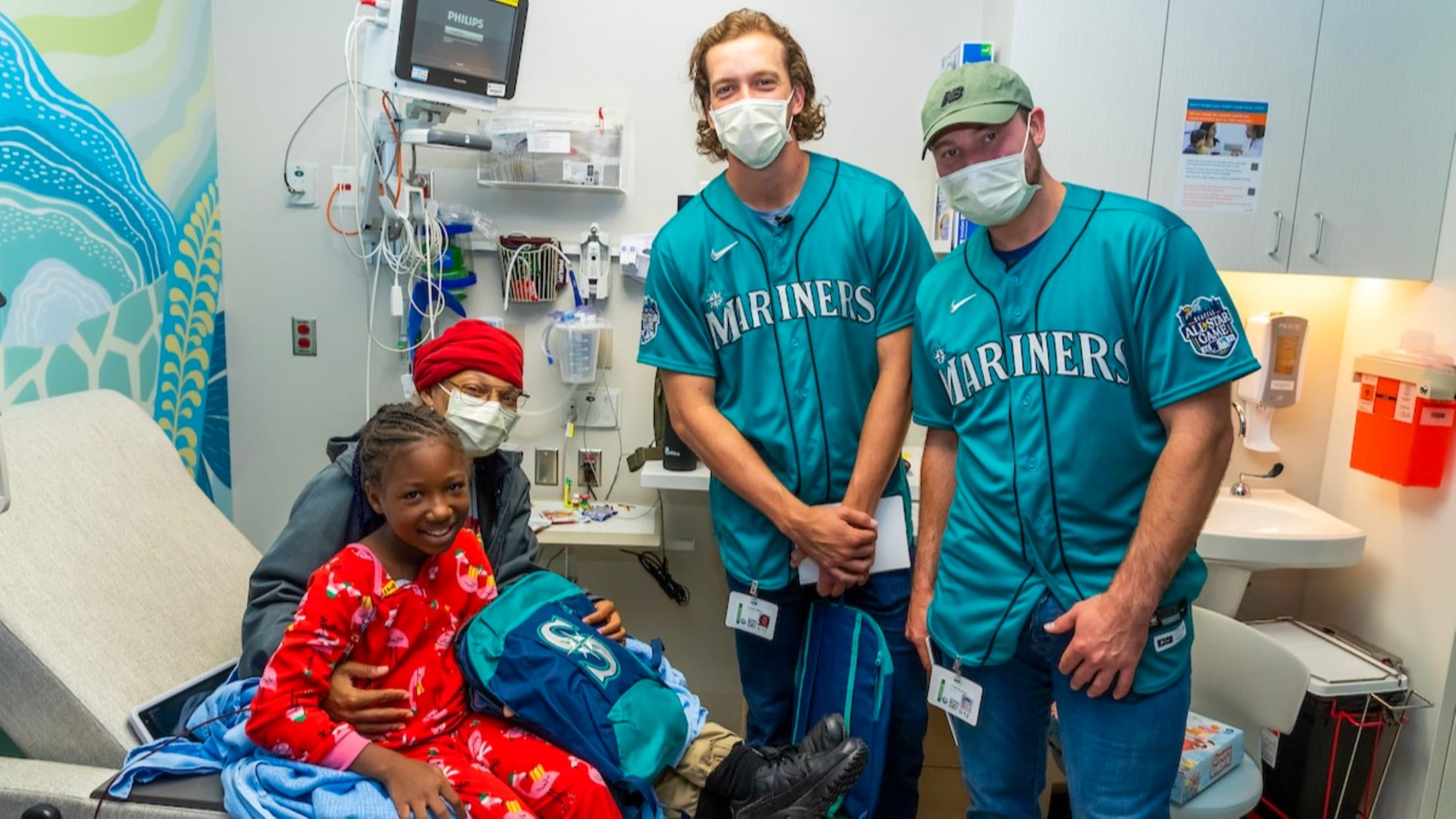 Logan Gilbert & Cal Raleigh visiting patients at Seattle Children's Hospital.