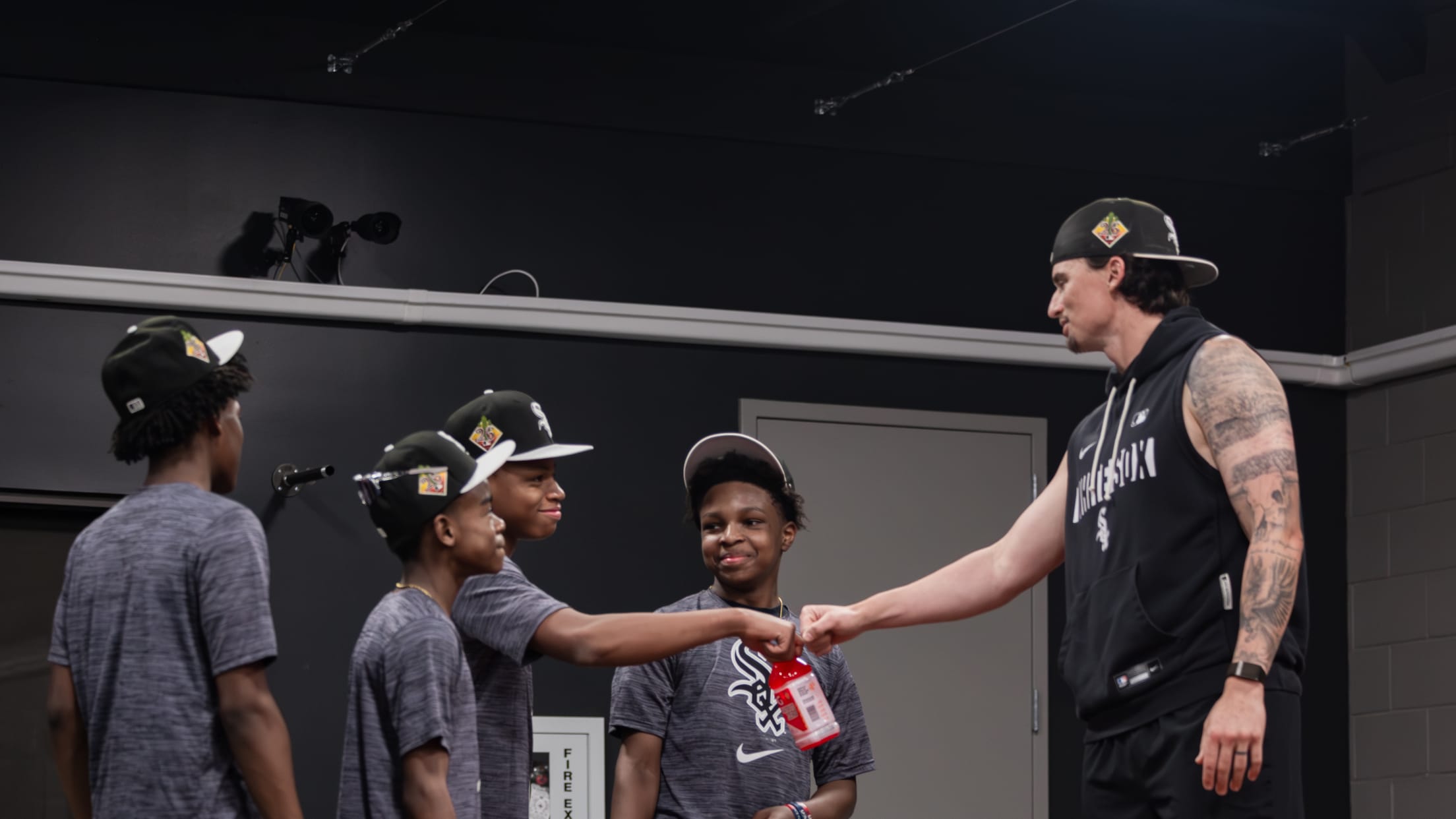 Davis Martin fist bumps youth baseball players from Amateur City Elite (ACE)