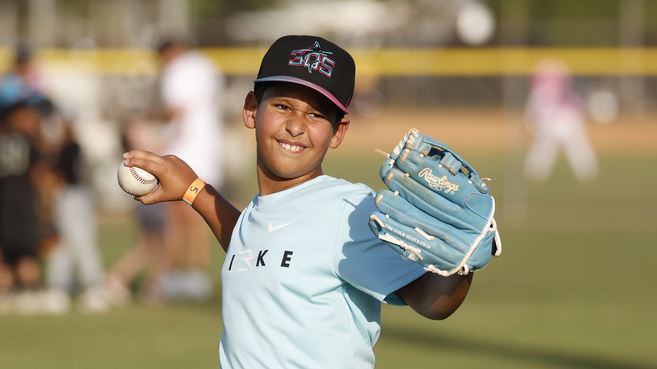 A player throws the ball as he takes part in the MLBPAA Legends for Youth Clinic.