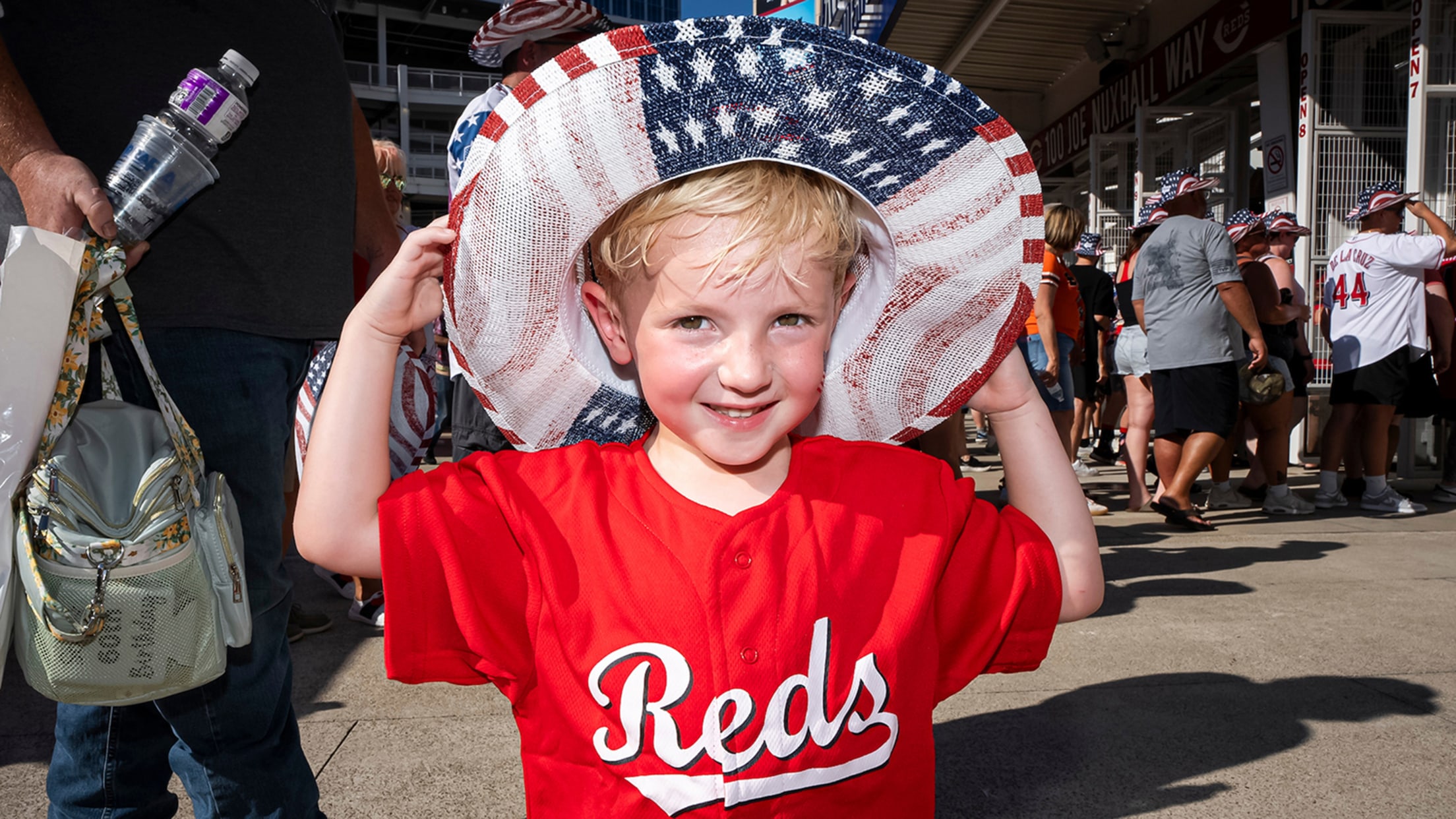 Young Reds fan supporting the Reds and the red, white and blue.