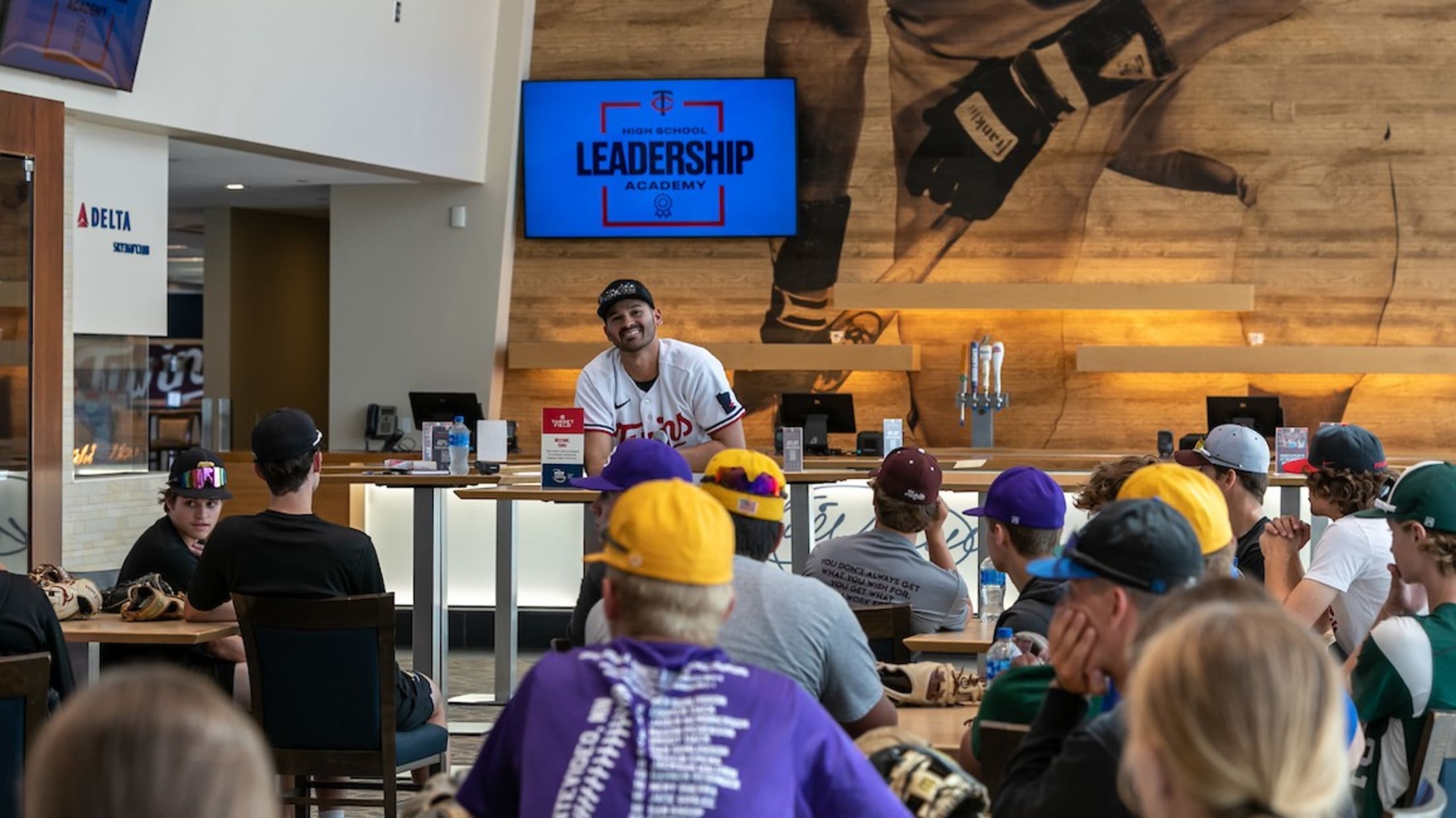 Pablo López joins youth baseball players at a leadership event.