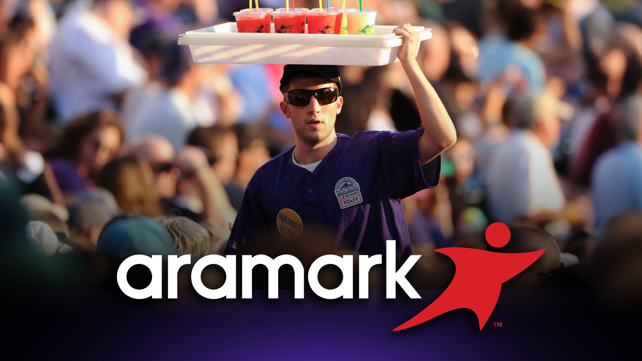 Aramark jobs featuring concessions staff bringing cold drinks to fans in seats.