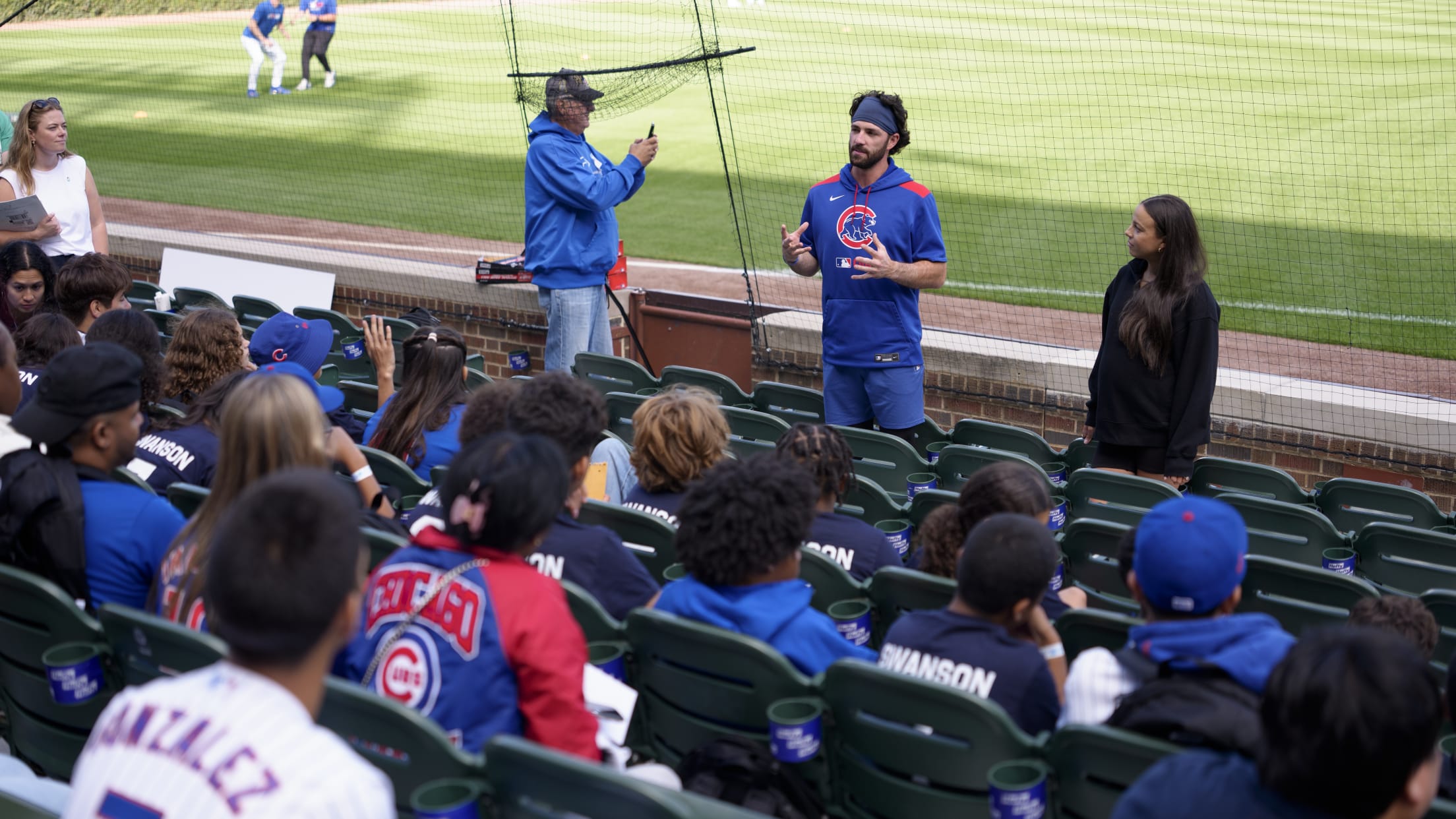 Dansby Swanson speaks to fans ahead of their game against the New York Mets.