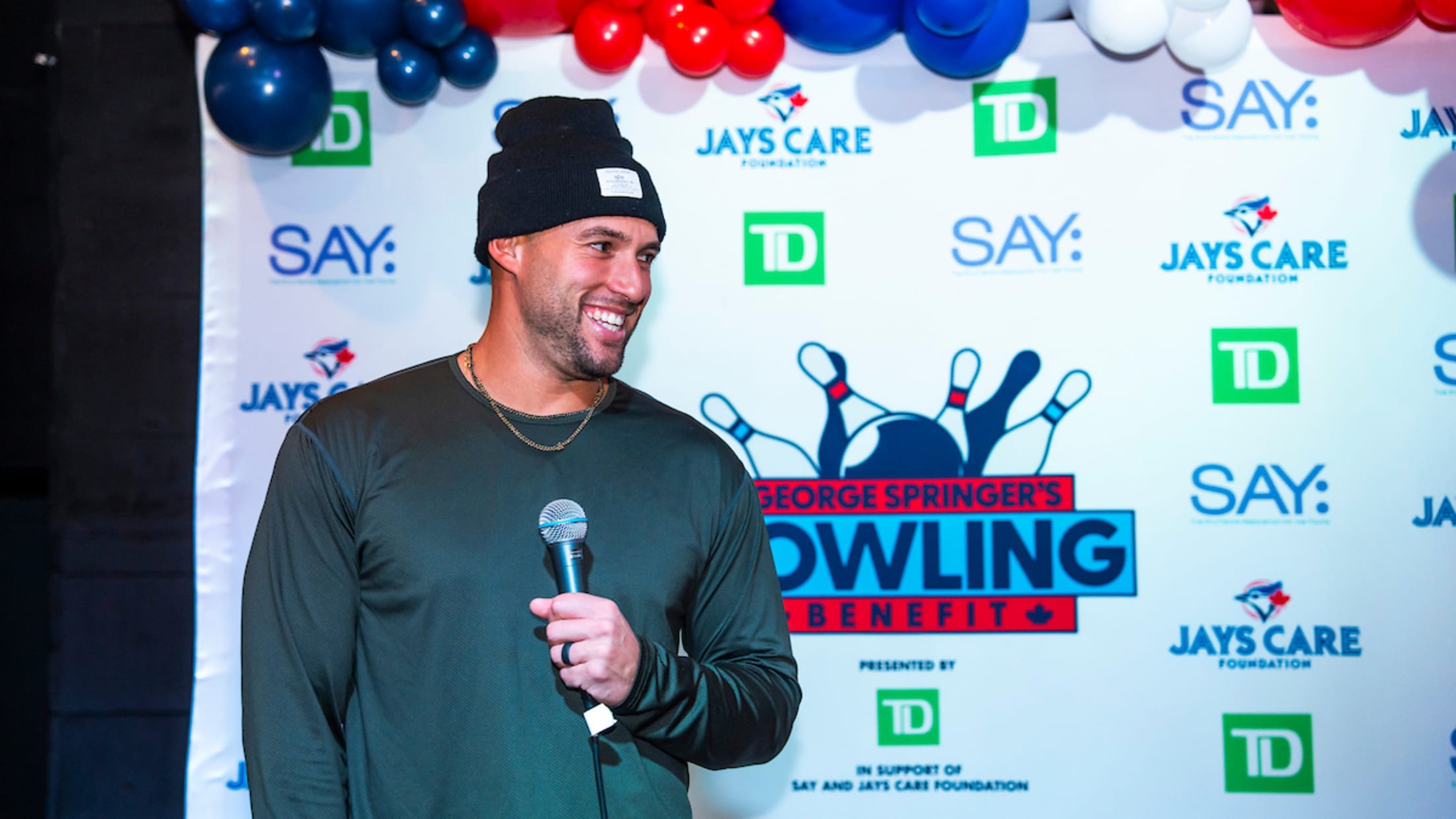 George Springer takes the mic at his bowling benefit.