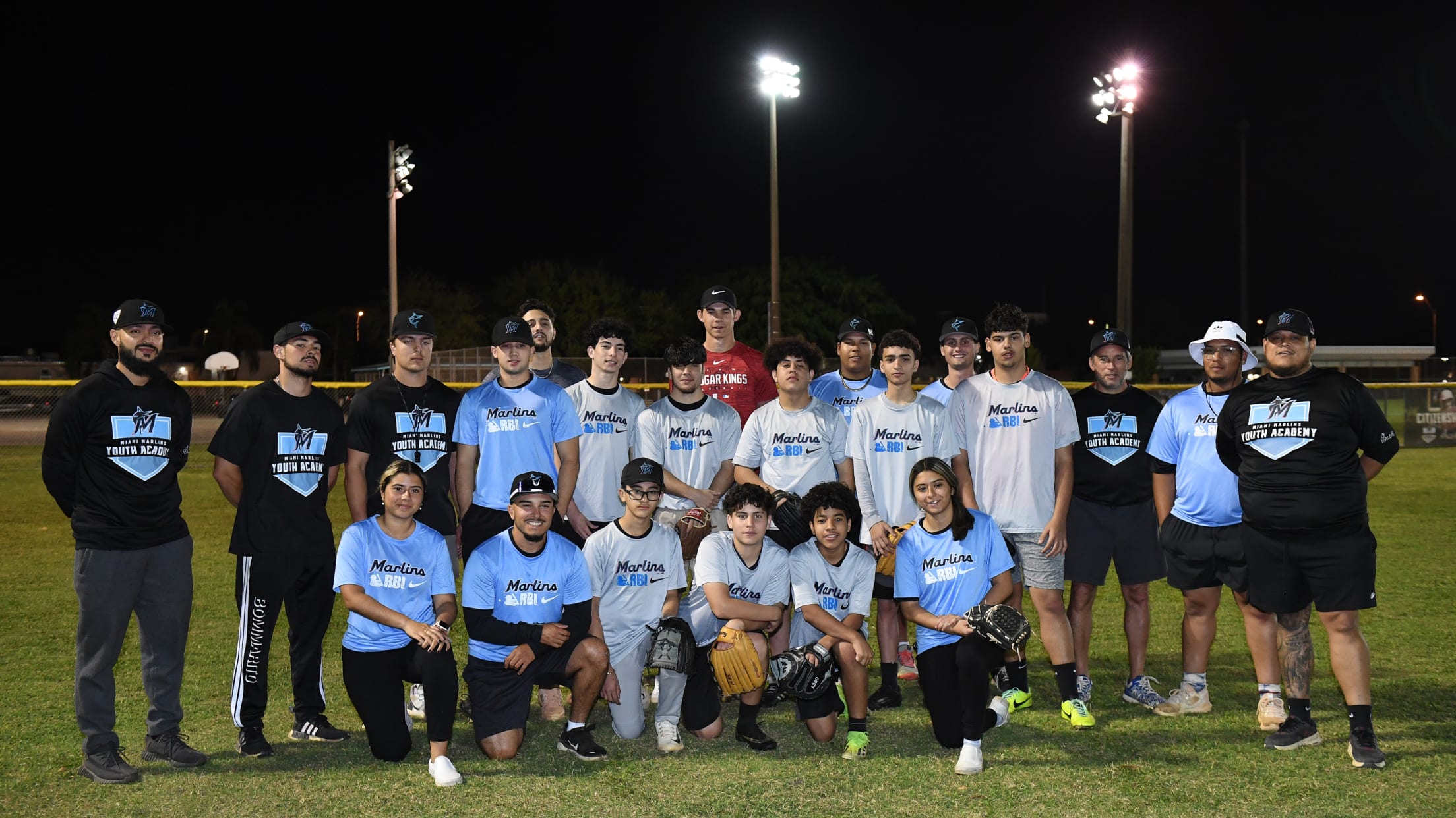 Players and coaches pose for a group photo at the Nike RBI Winter Development Clinic.