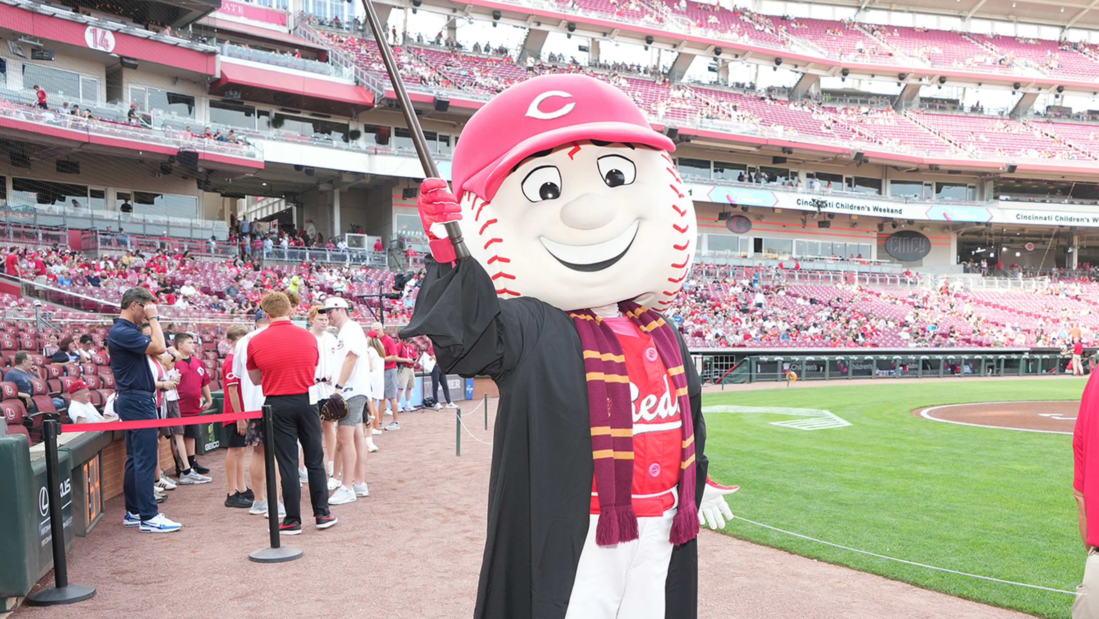 Mr. Red mascot dressed in Gryffindor™ outfit on the field.