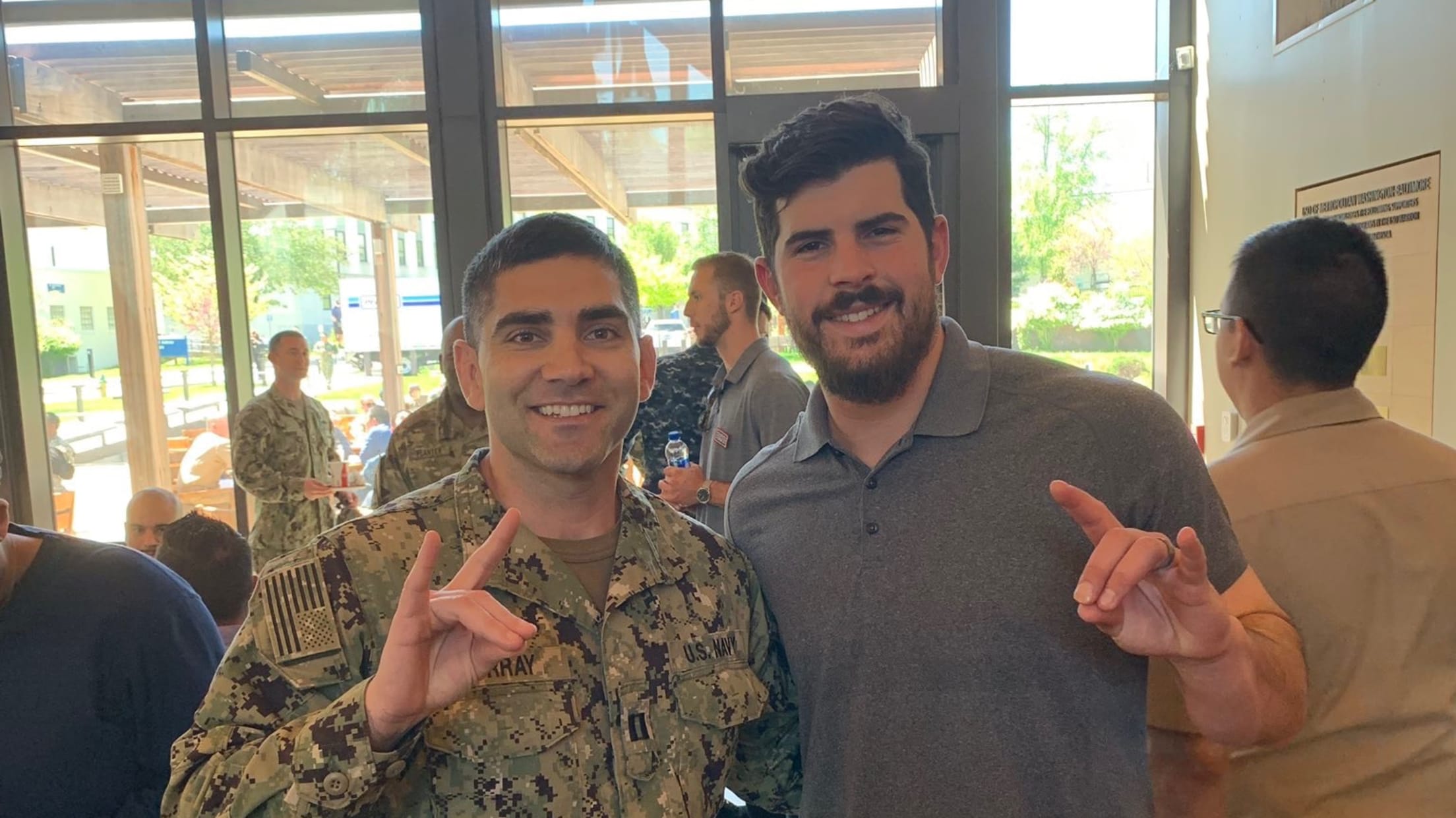 Carlos Rodón poses for a photo with a member of the military.