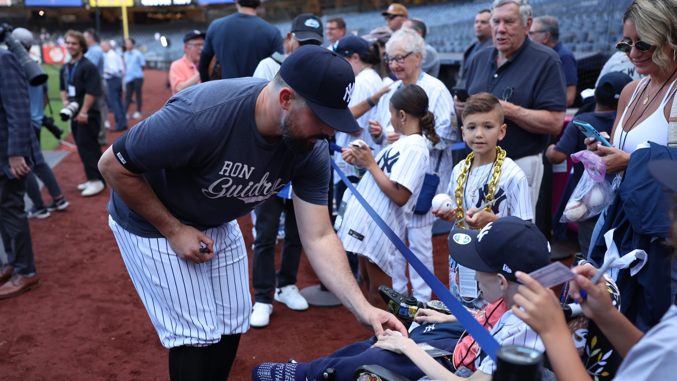 Carlos Rodón meets a young fan at Yankee Stadium.