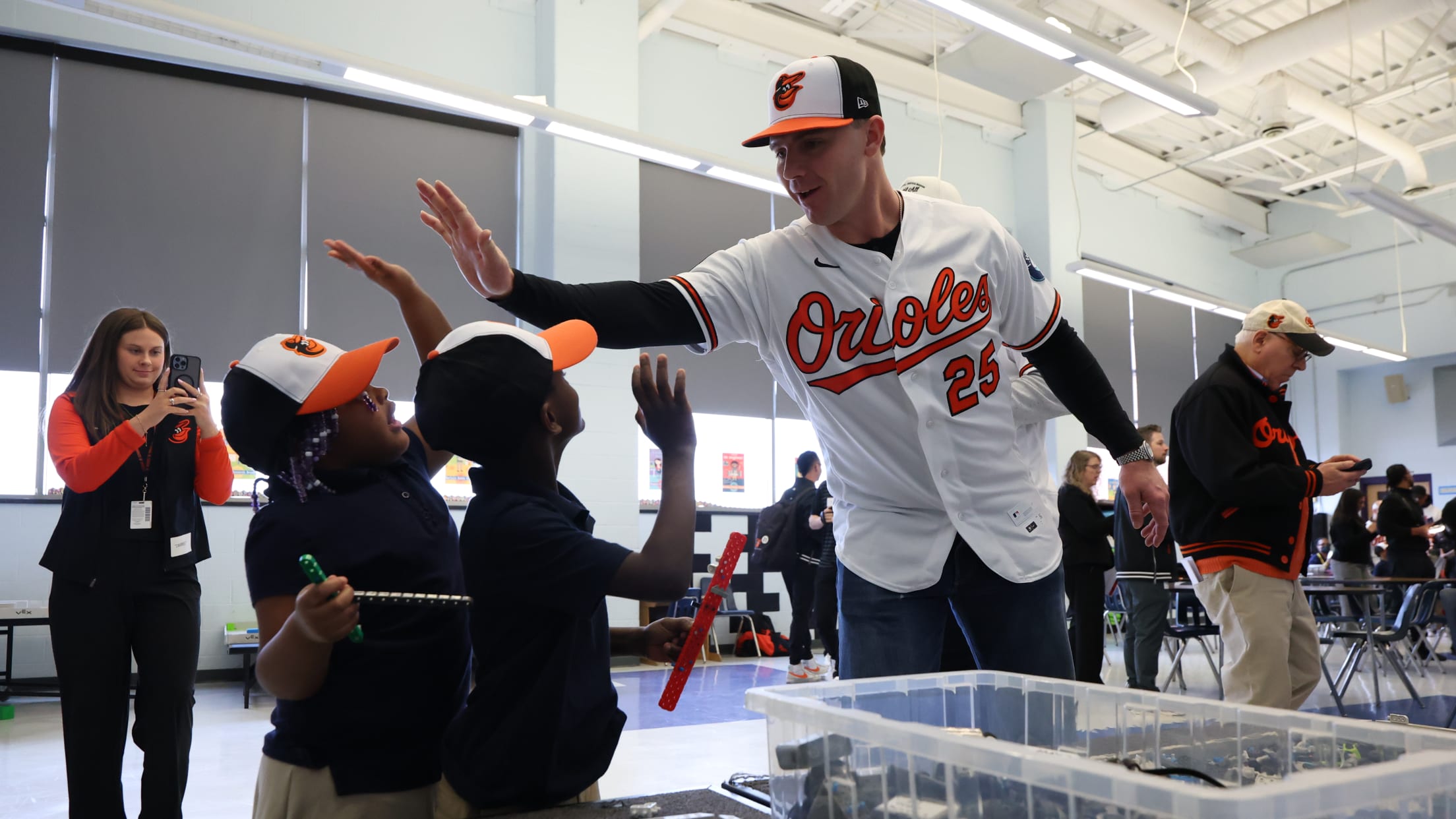 Pete Alonso high fives young Baltimore Orioles fans at an event.