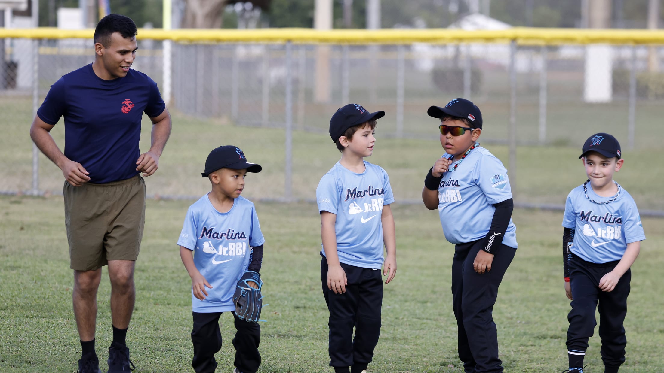 A coach and his players get ready for the next drill at the Marlins Nike Jr. RBI.