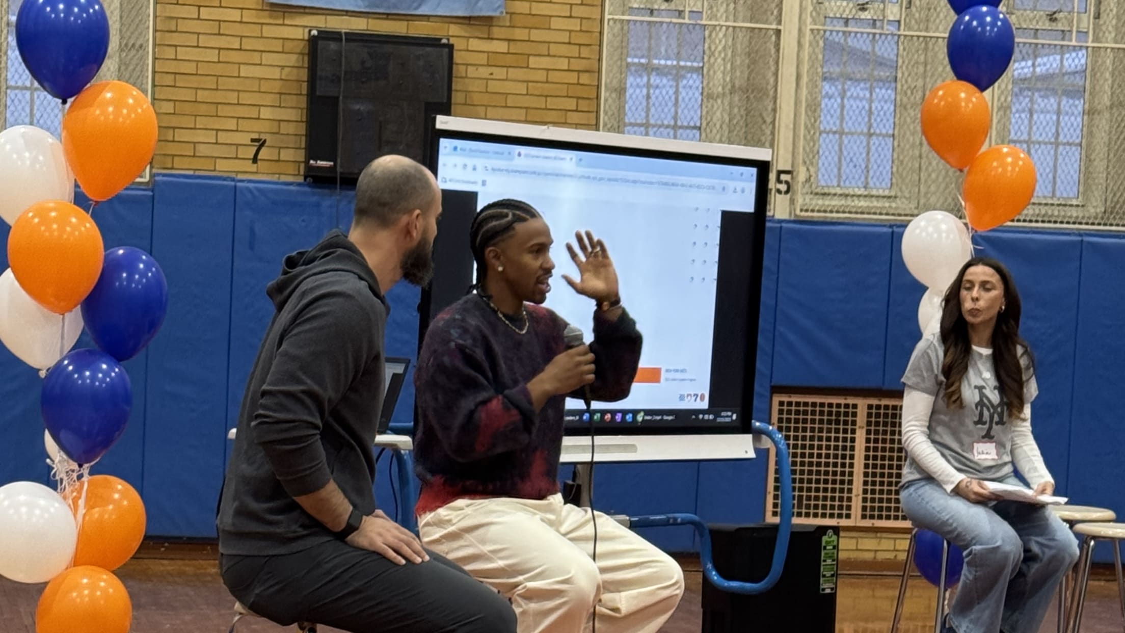 Francisco Lindor talks at a school as he partakes in a backpack giveaway event.