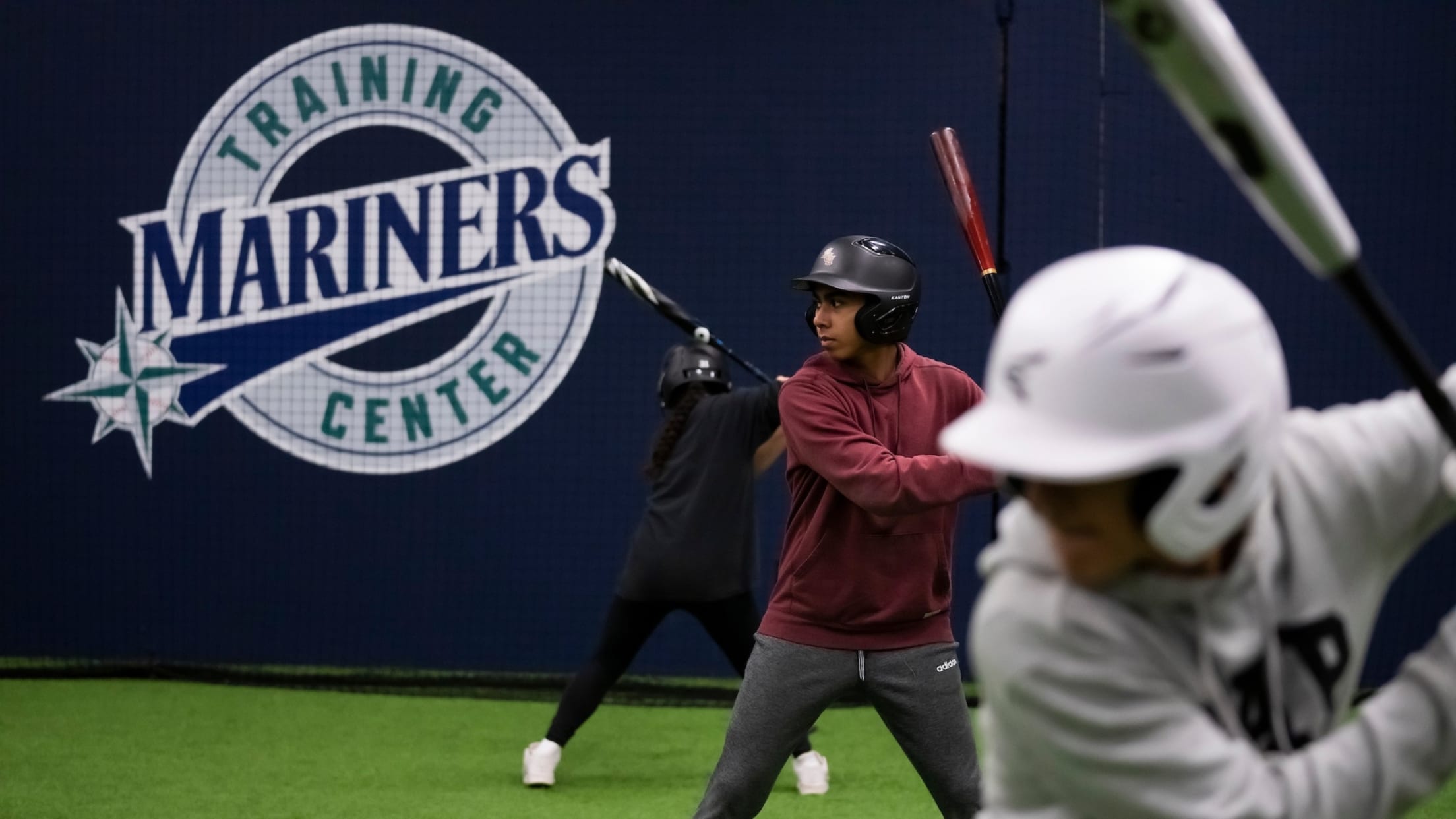 Image of young fans at a Mariners Training Center facility.