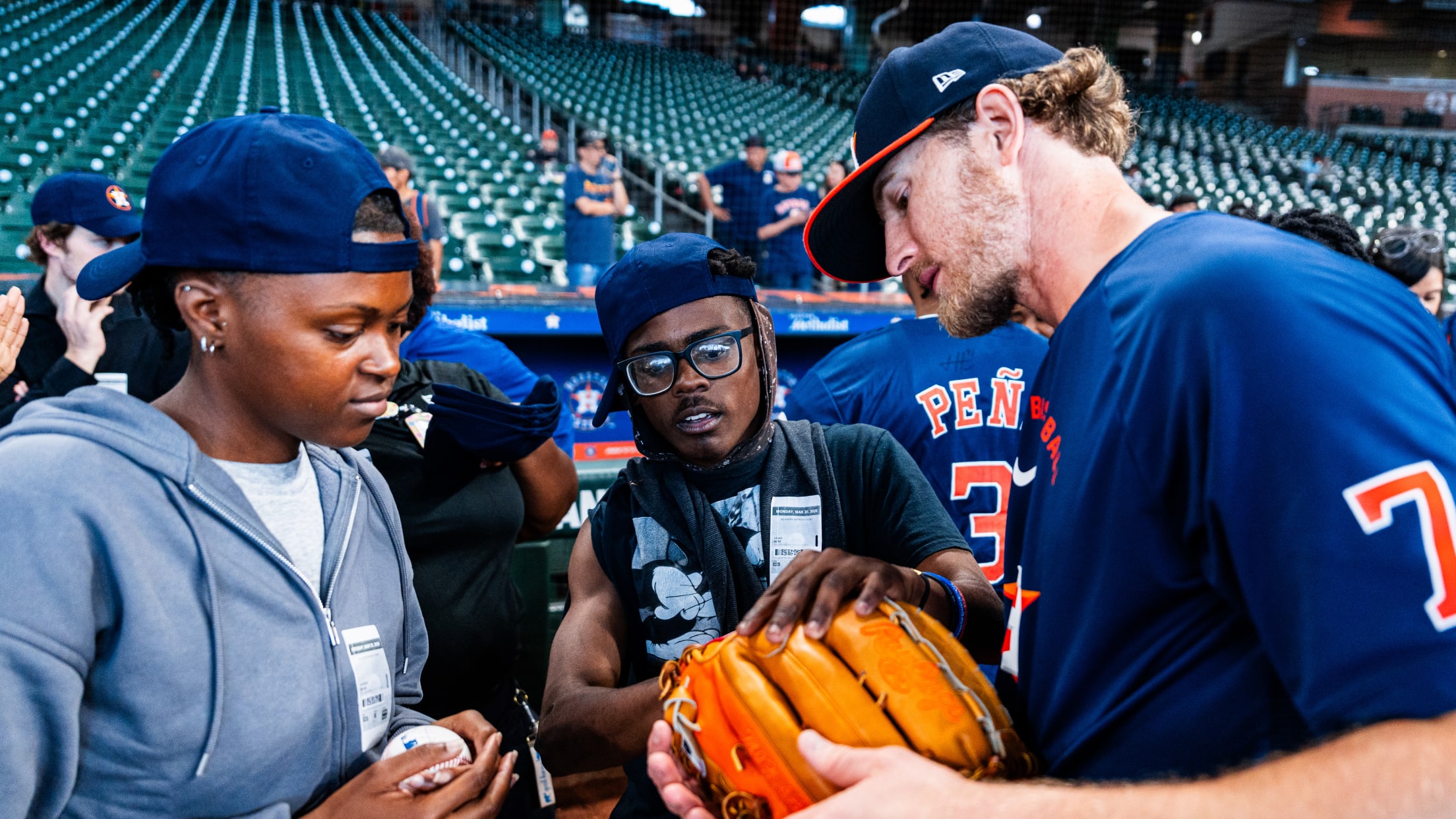 Josh Hader hangs out with fans during pregame practice.