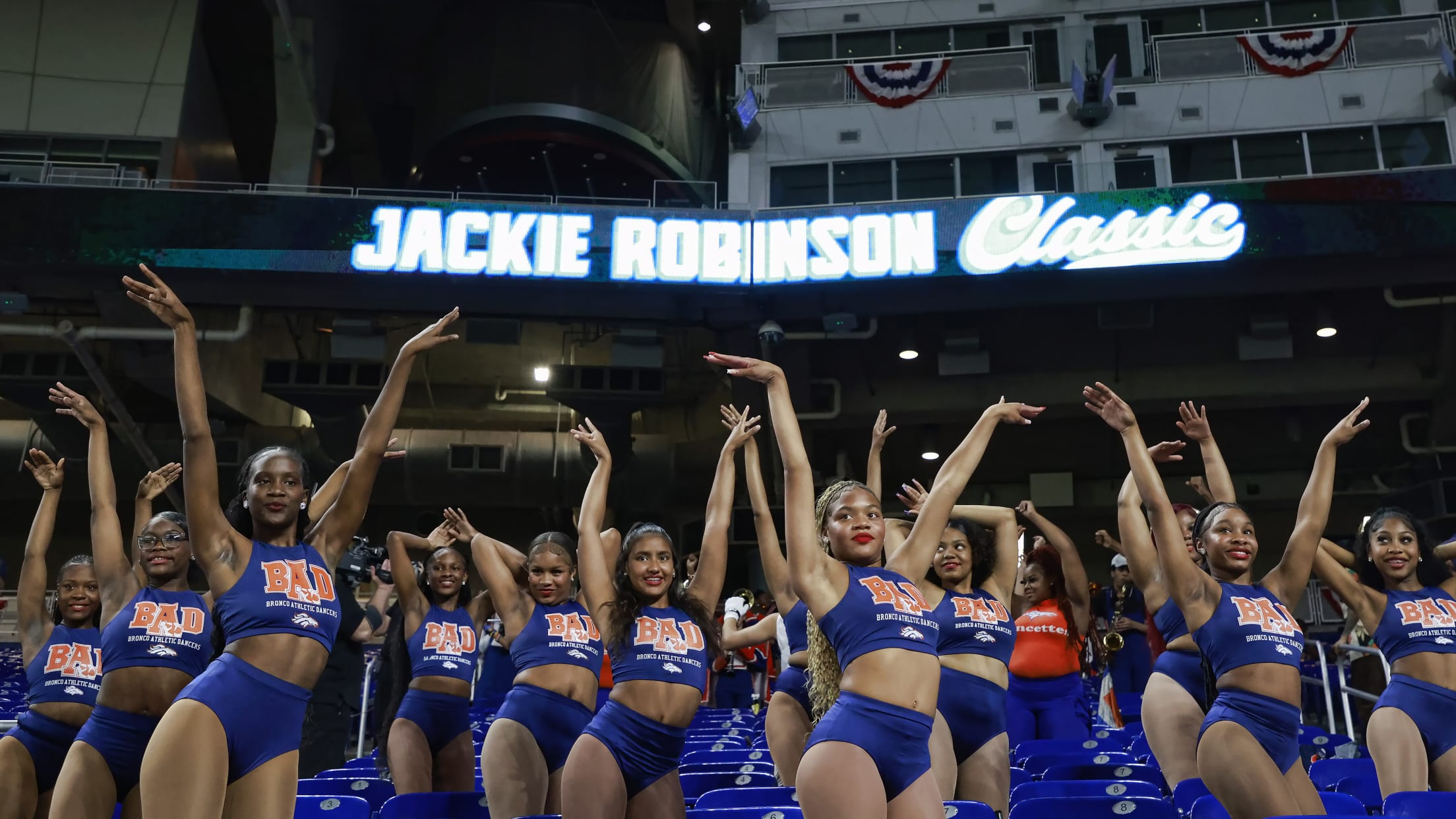 Dancers pose in the outfield seats at the Jackie Robinson Classic.