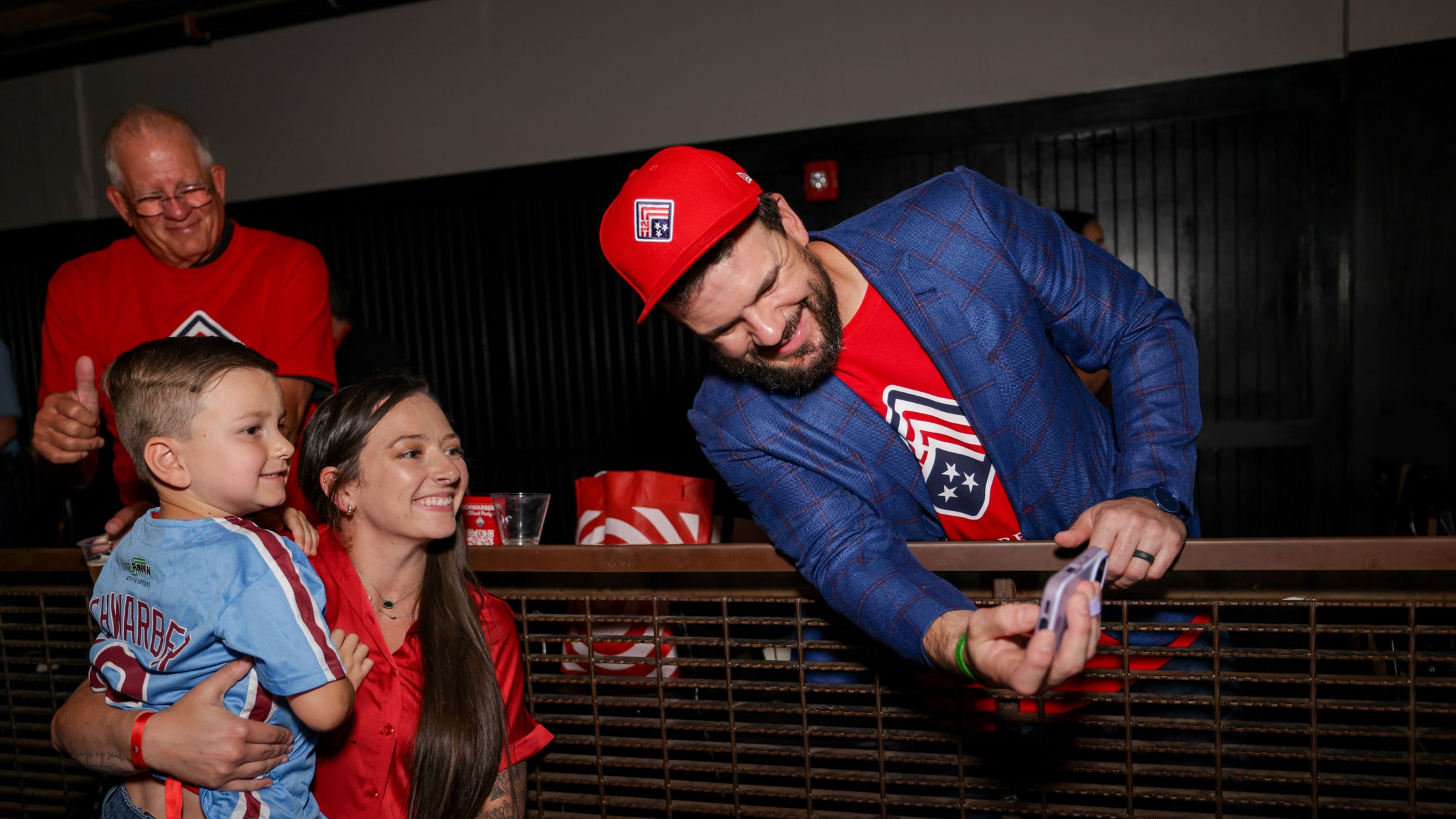 Kyle Schwarber takes a picture with Philadelphia Phillies fans at Schwarber's Block Party at Union Transfer.