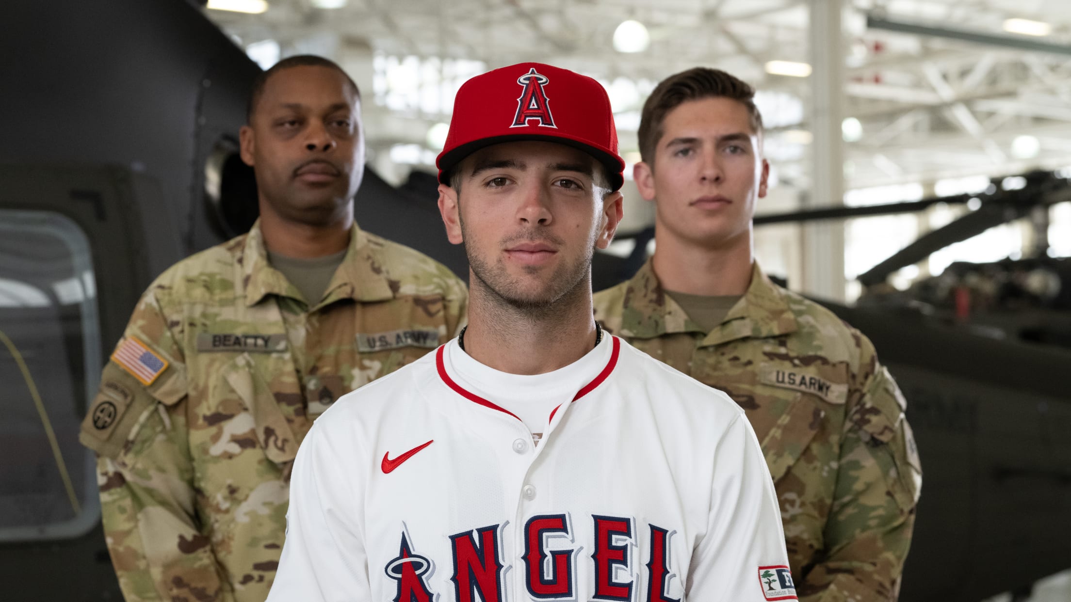 Zach Neto poses with United States service members.