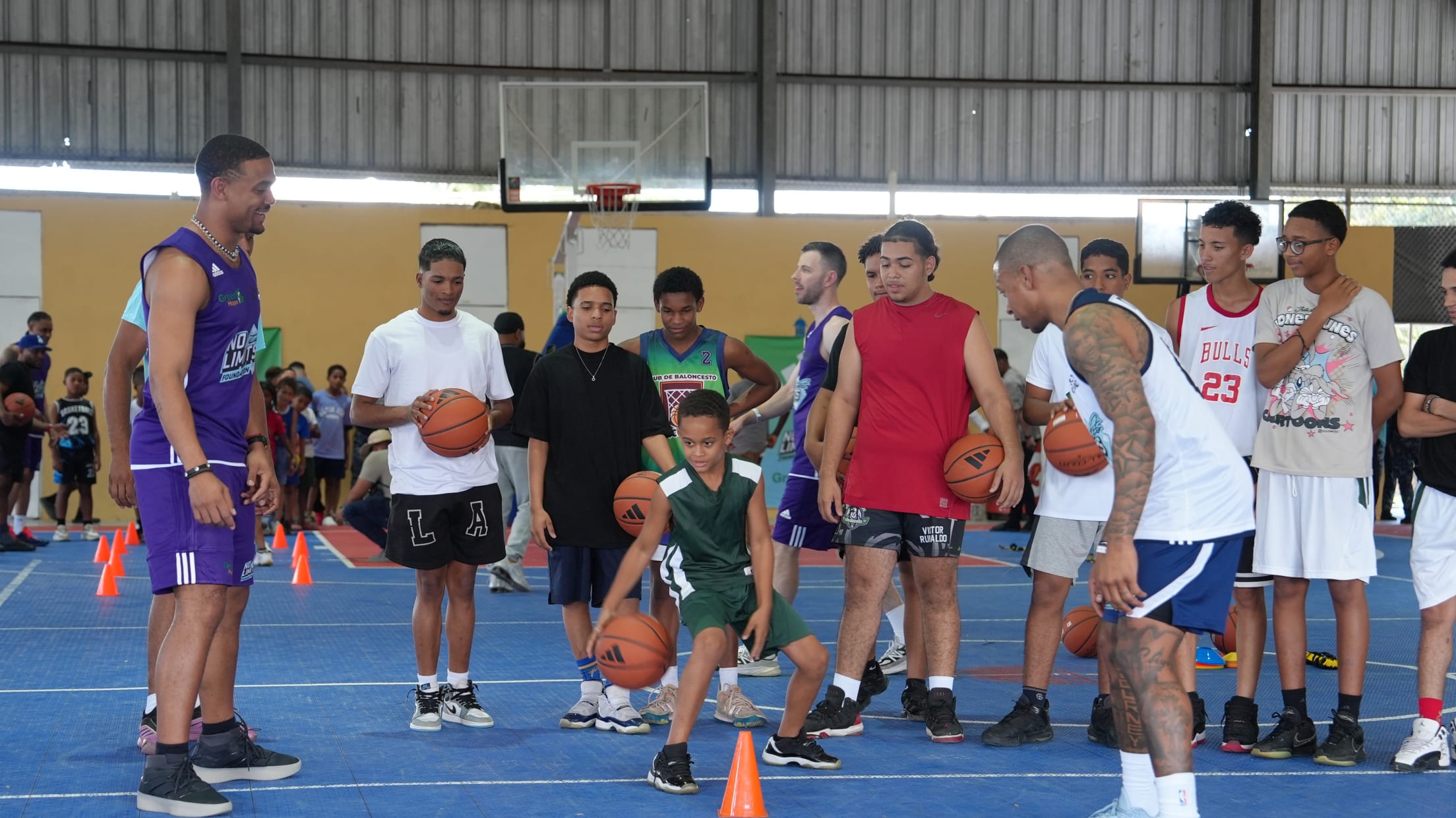 Julio Rodriguez participates in basketball drills at at a Three Kings Day Basketball Clinic.