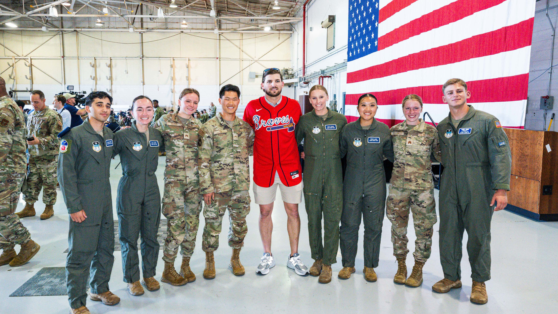 Austin Riley takes a picture with United States service members.