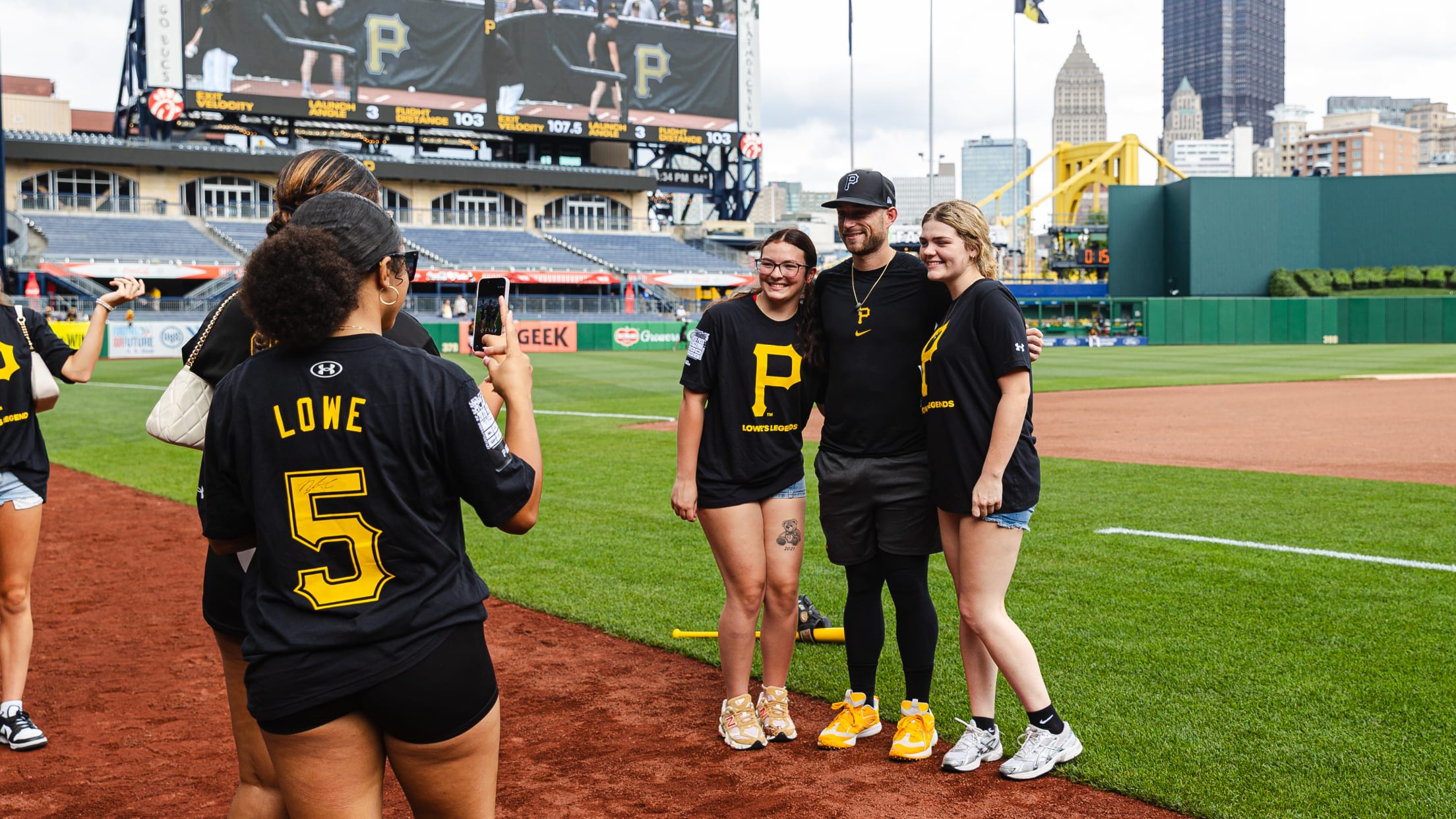 Brandon Lowe takes a photo with fans on the field at PNC Park.