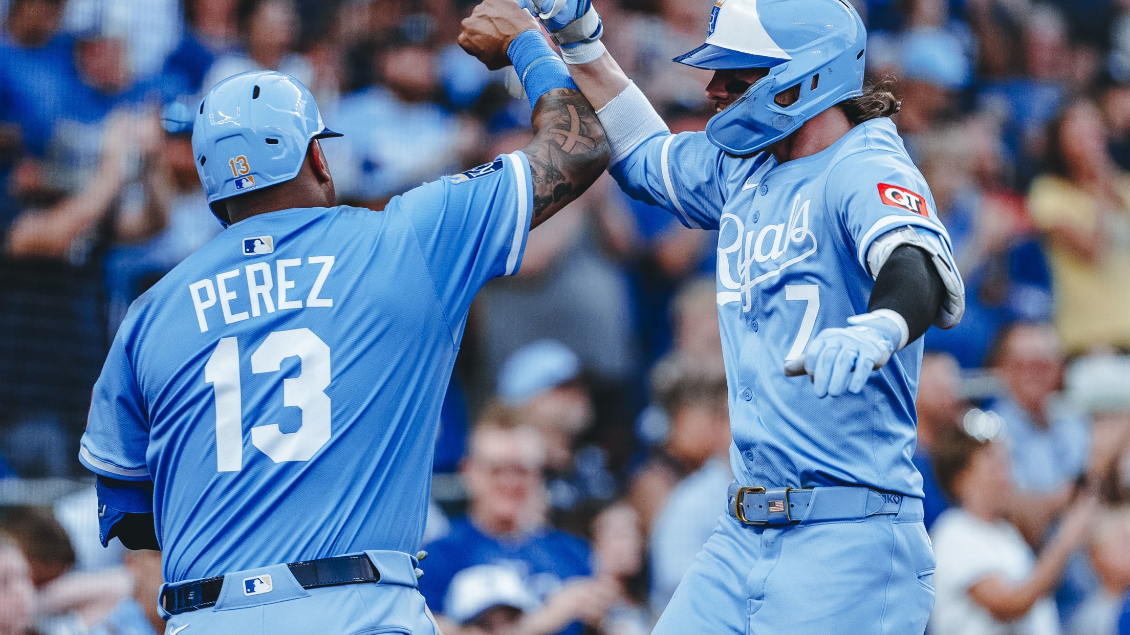 Bobby Witt Jr. celebrates with teammate Salvador Perez.