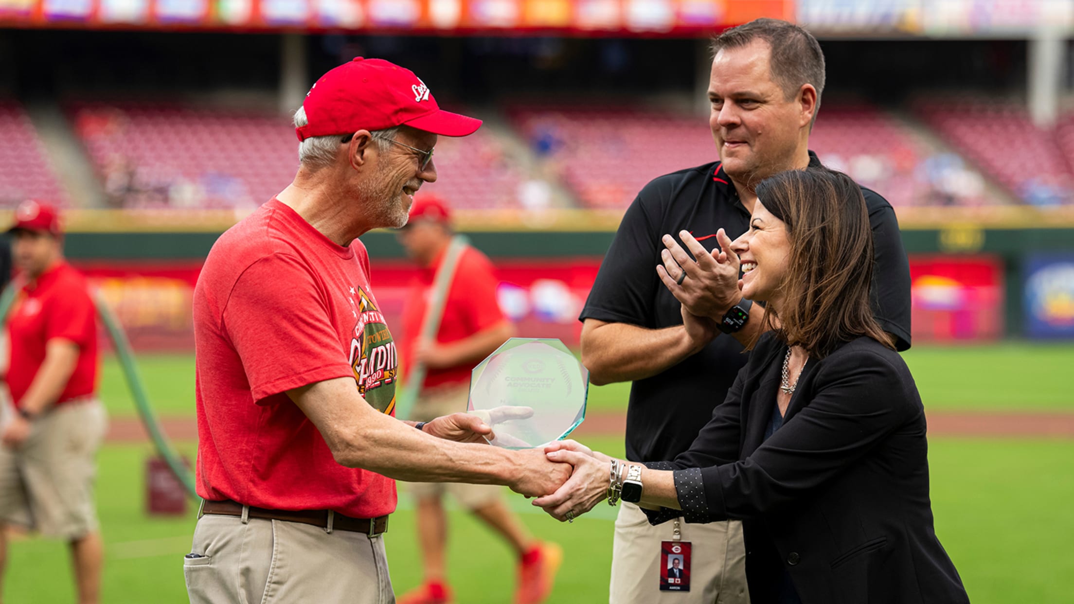 Reds present H.A. Musser Jr. being presented with the Hispanic Community Advocate Award during a pregame ceremony.