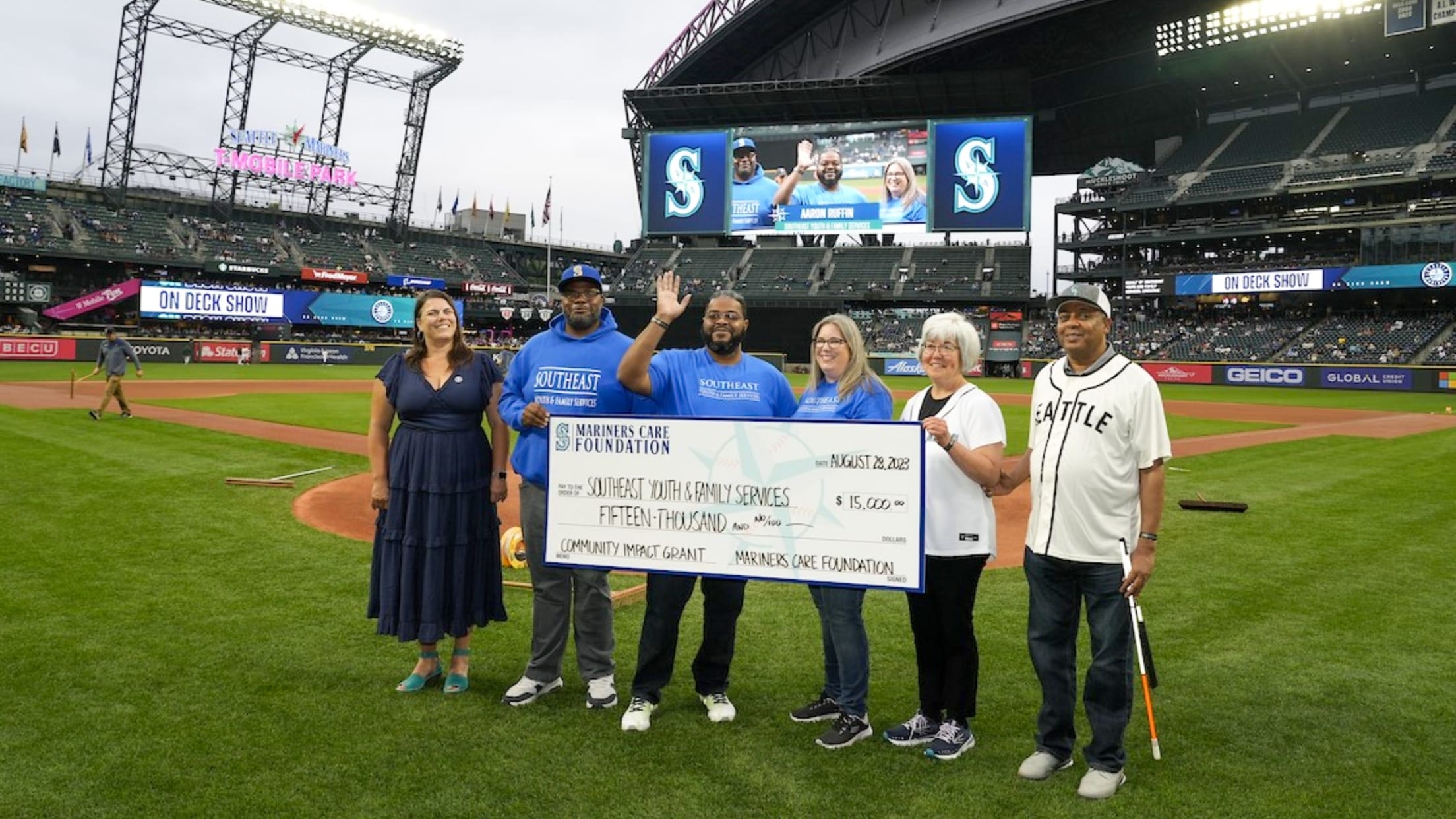 Mariners Care Foundation check presentation on-field at T-Mobile Park.