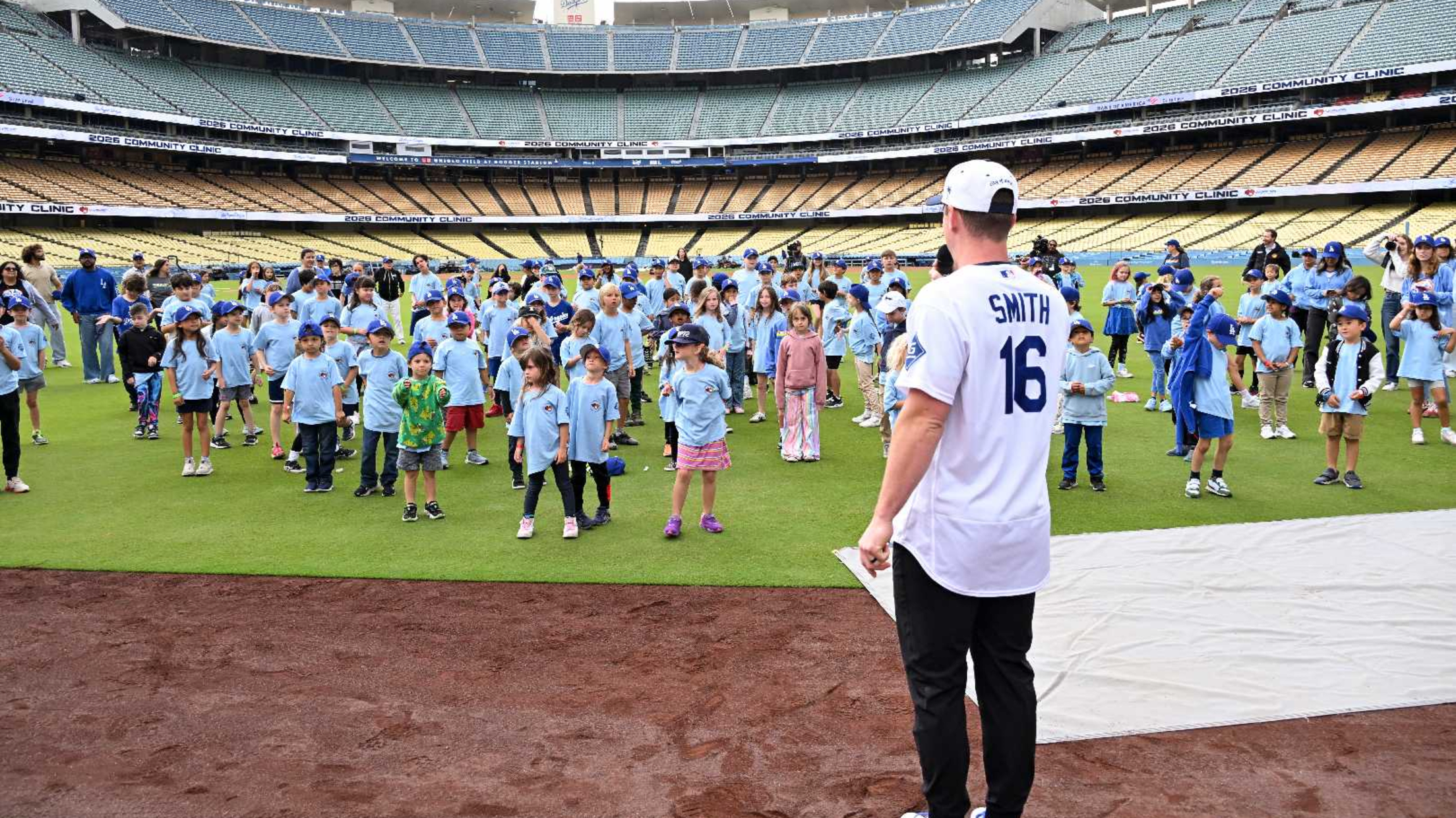 Will Smith takes part in activities with kids at Dodger Stadium.