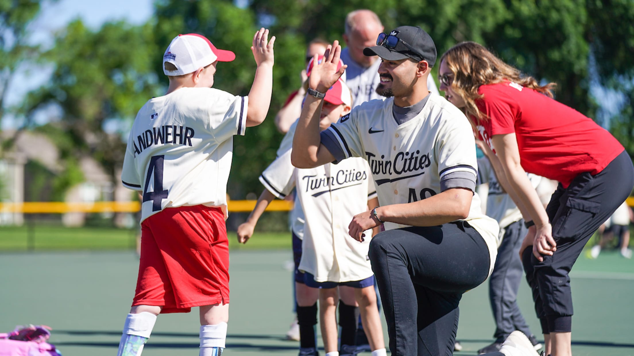Pablo López high fives a fan as they participate in an event.