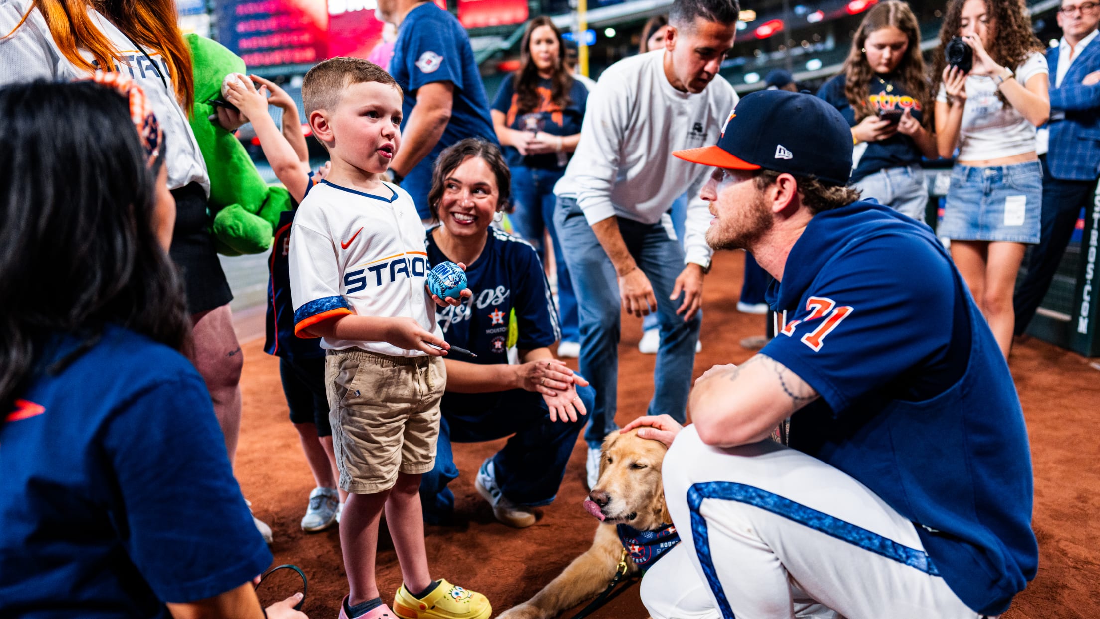 Josh Hader listens to a young Houston Astros fan.