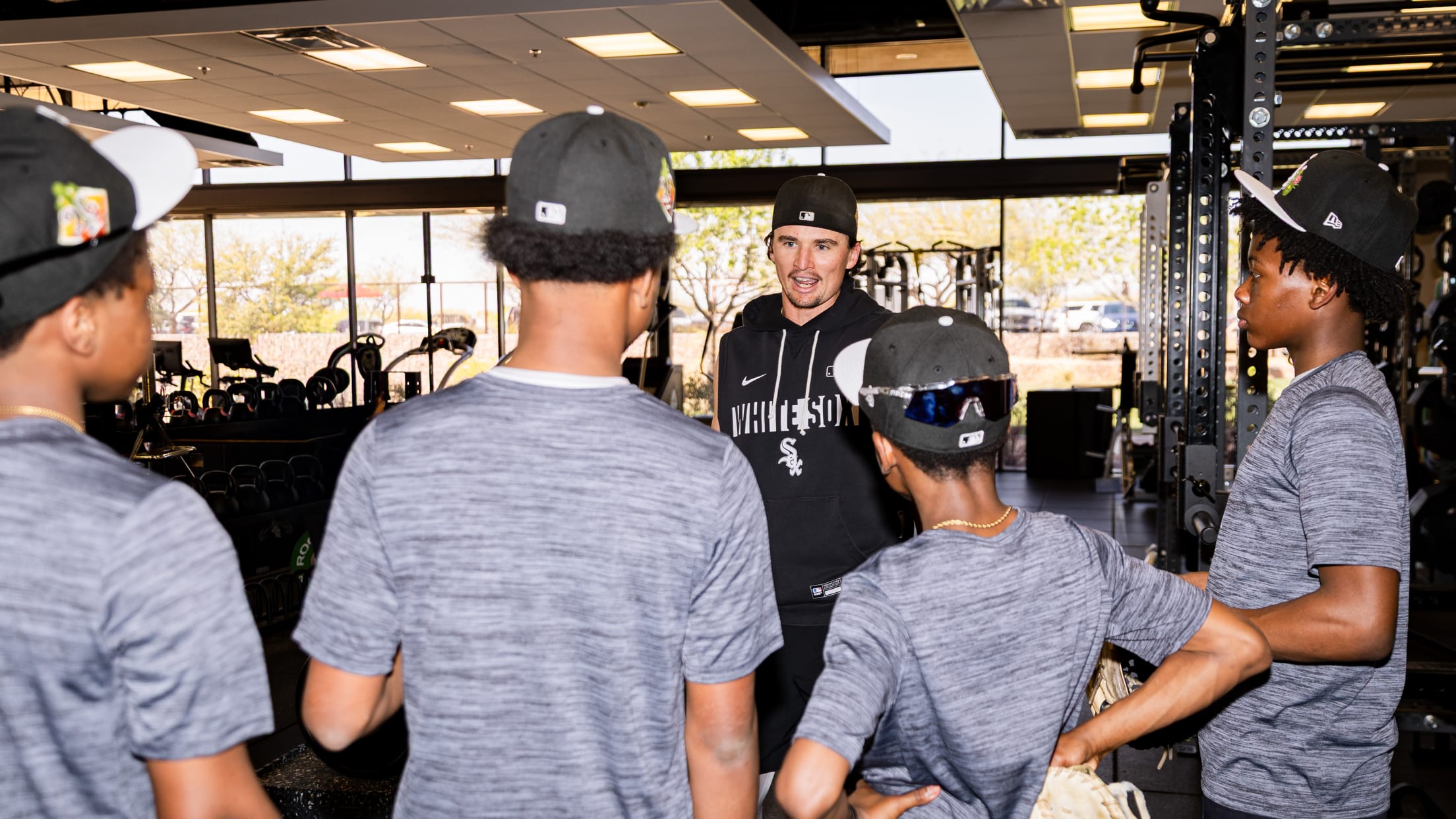 Davis Martin talks with youth baseball players from Amaetur City Elite (AMC) during Spring Training.