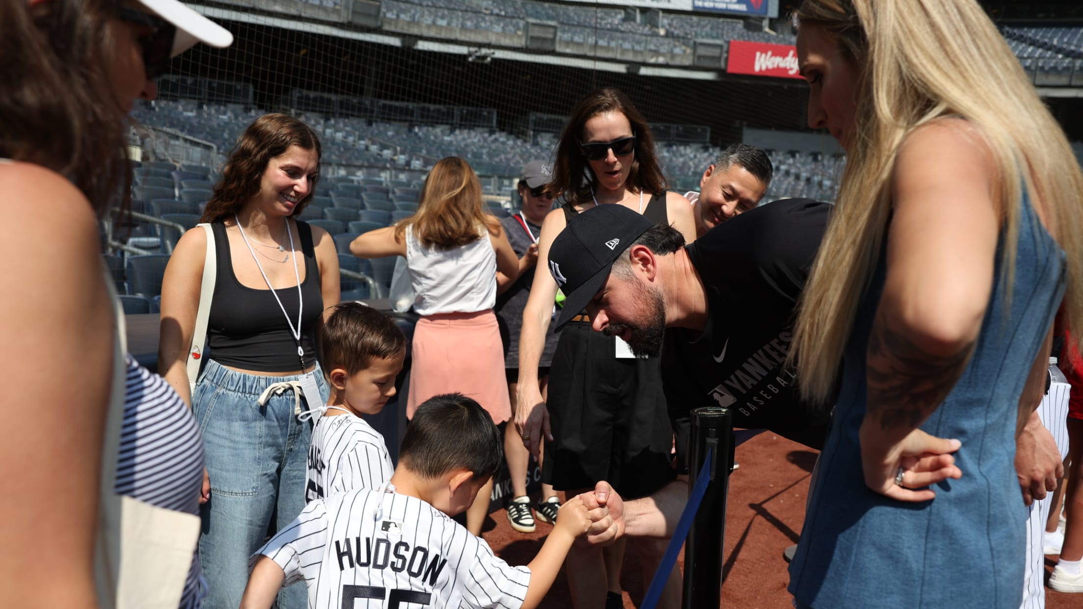 A young fan shakes hands with Carlos Rodón.