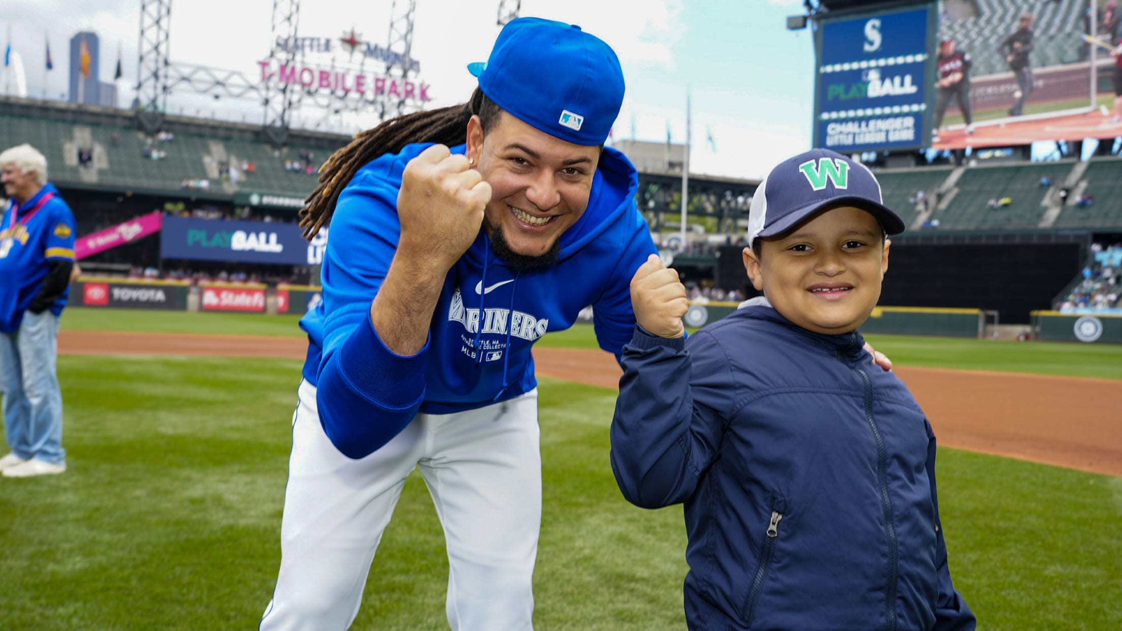 Image of Luis Castillo with young fan.