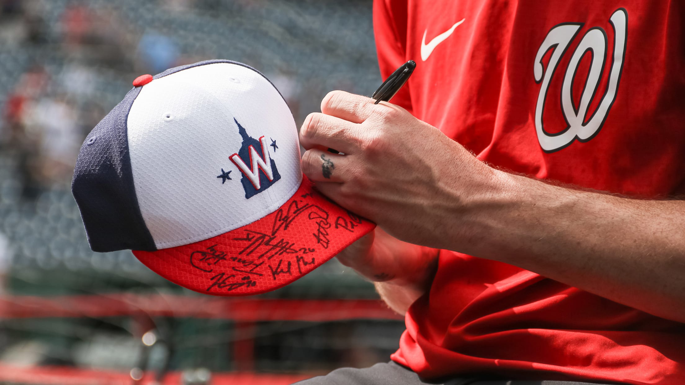 Nationals player signing autographs