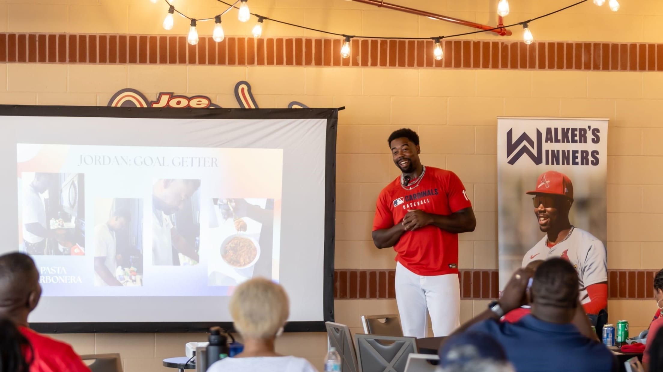 Jordan Walker talks with a group of people at a Walker's Winner's event.