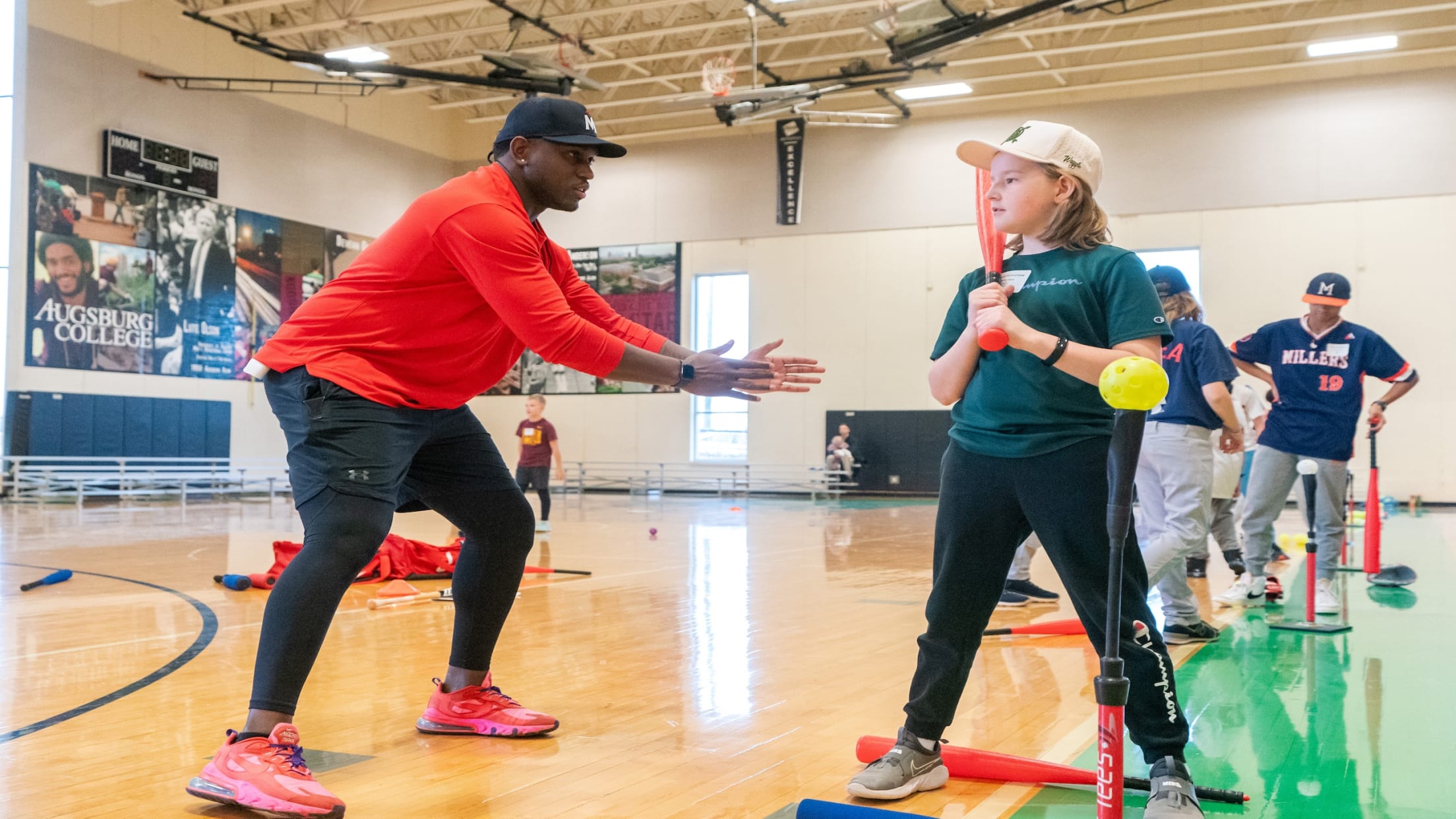 Twins players participating in a youth baseball clinic
