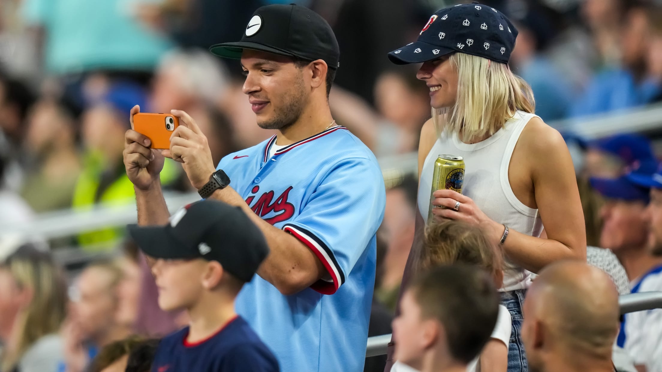 Twins fan taking a photo at Target Field