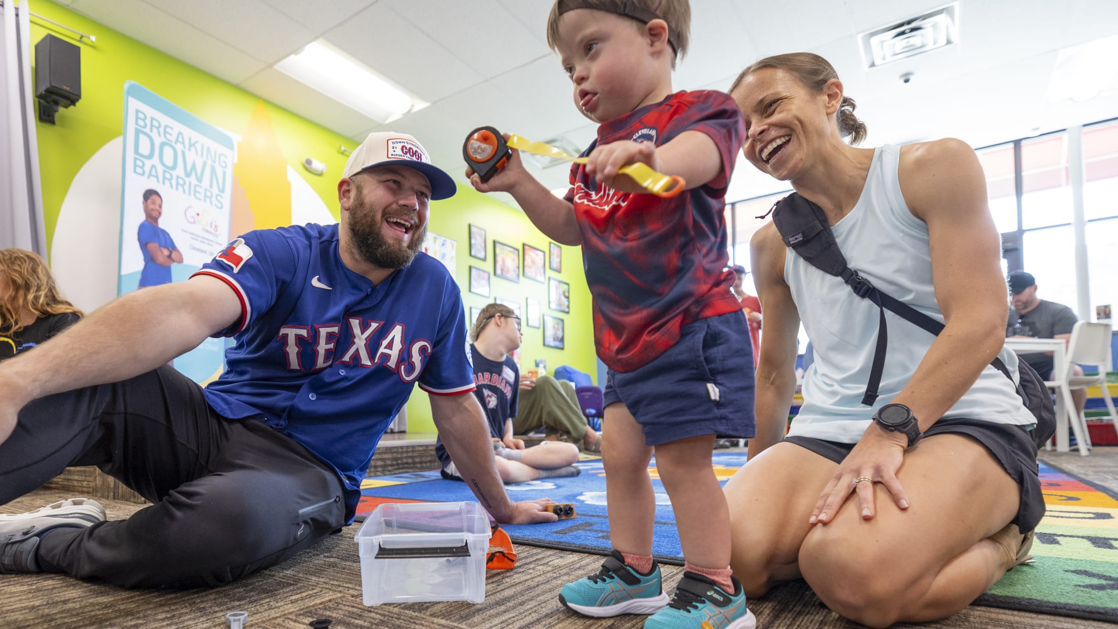 Jake Burger plays with a young child at Gigi's Playhouse.