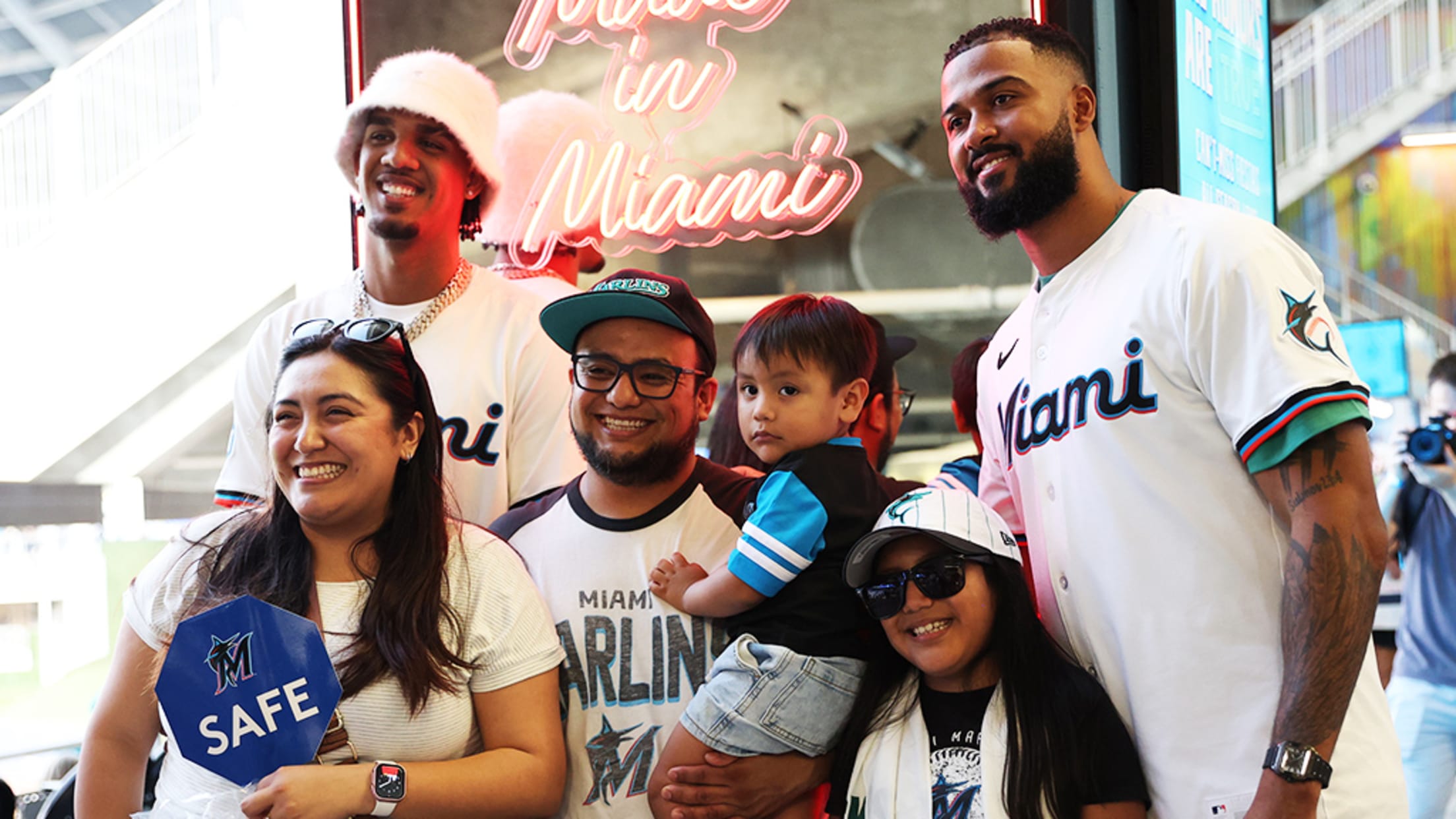 Fans taking photos with Marlins players