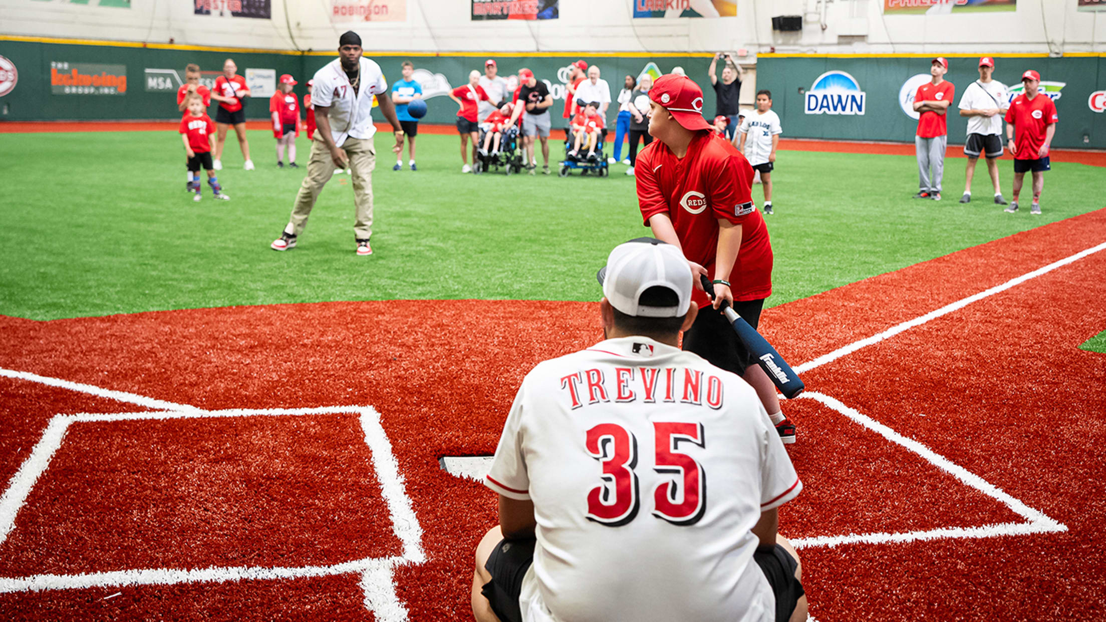 Luis Mey and Jose Trevino pitching and catching during the clinic's live batting practice.