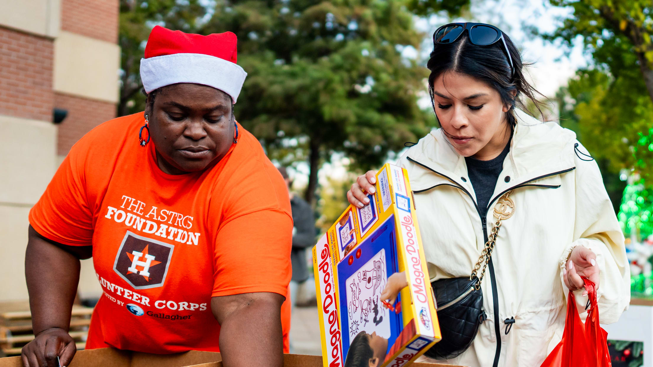 Volunteers gift toys at Hader's Heart Toy Drive.