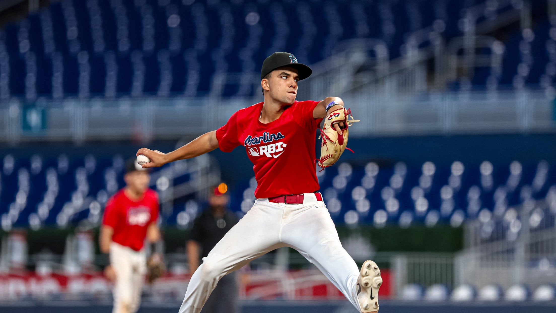The pitcher winds up to fire a pitch at the Marlins Nike RBI Wood Bat Championship.